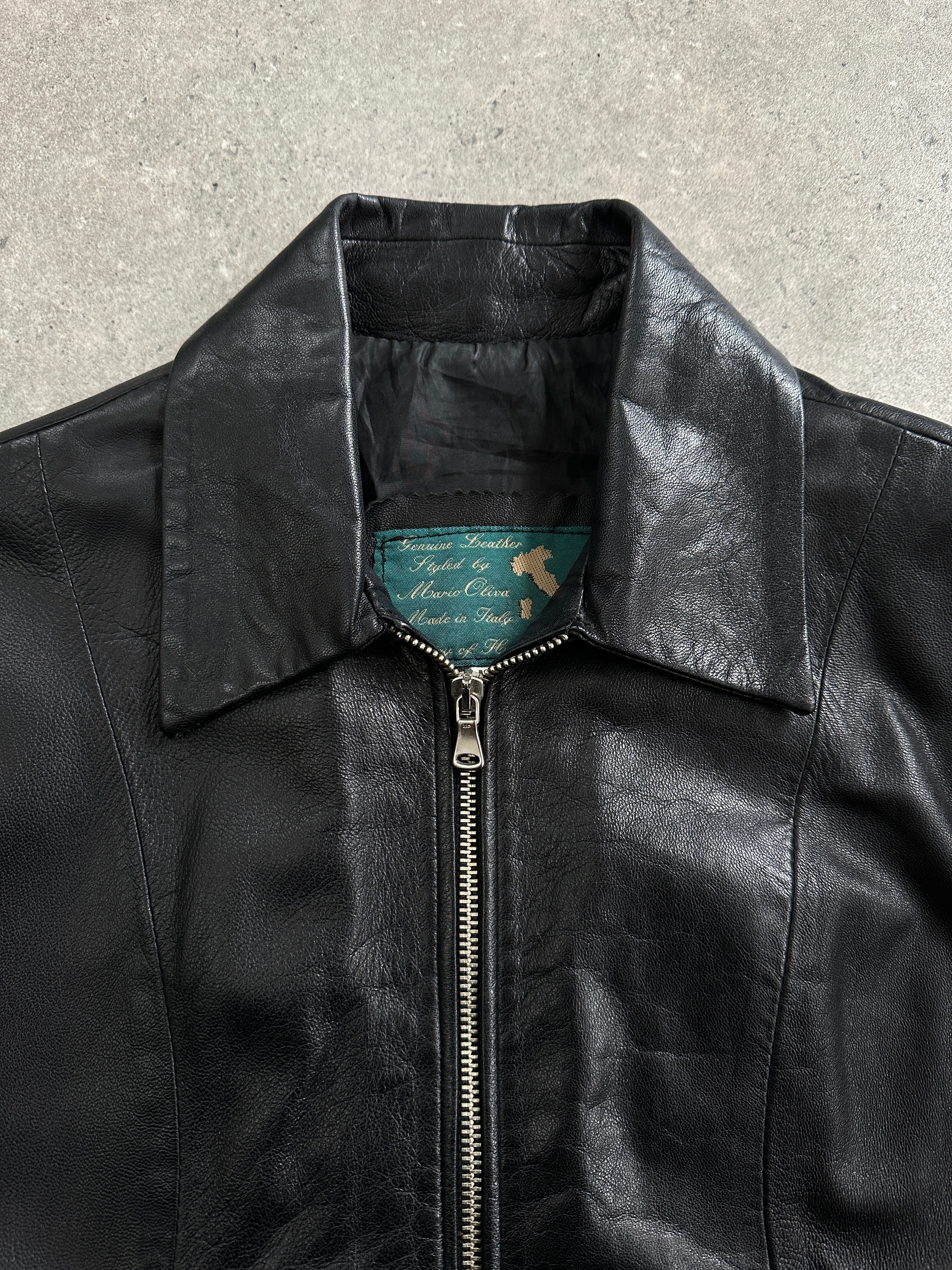 Vintage Italian 1990s double zip leather jacket featuring classic black leather and silver hardware, size small.