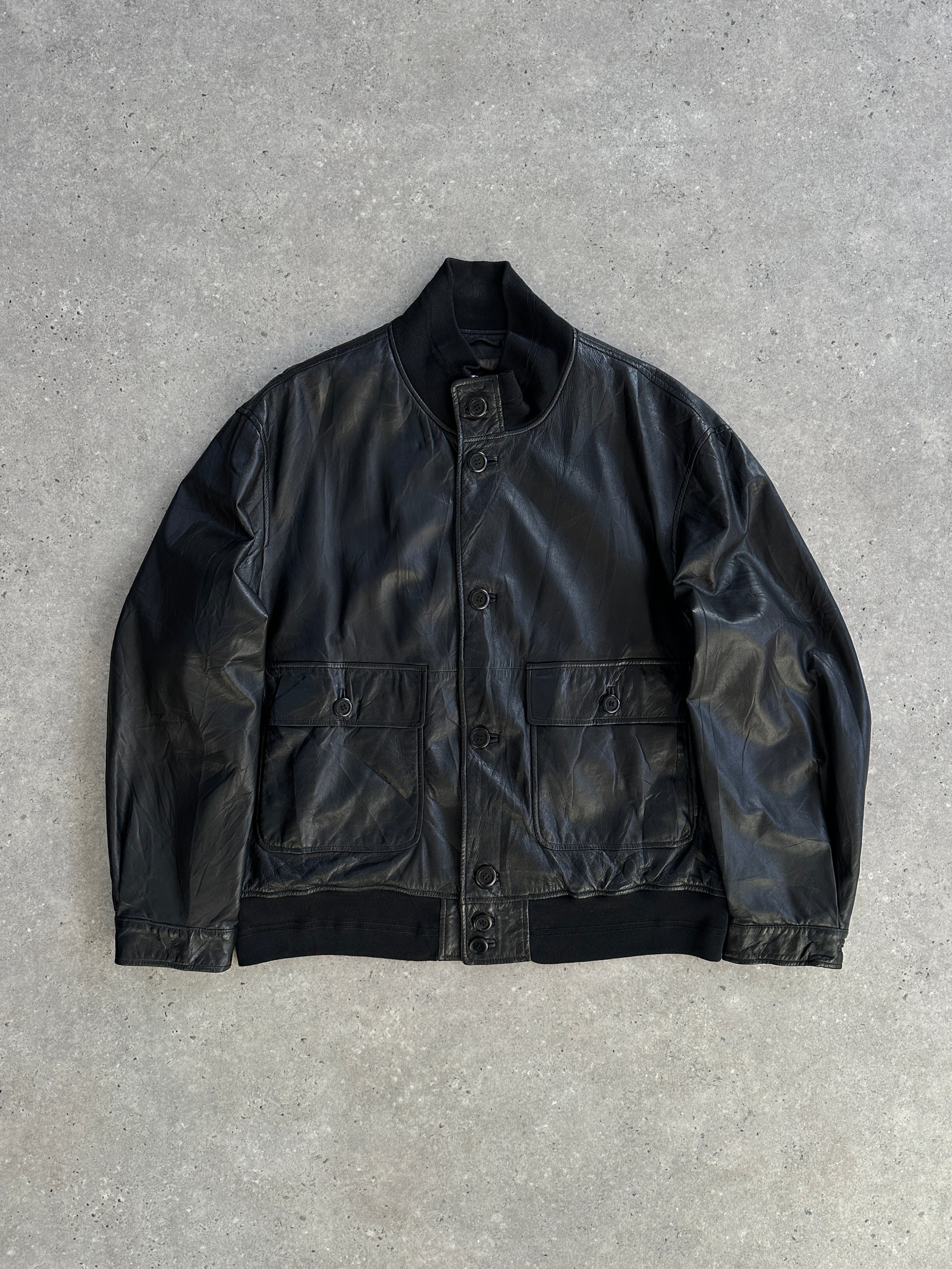Hugo Boss leather bomber jacket in XL with a sleek design, featuring smooth leather and stylish collar details.