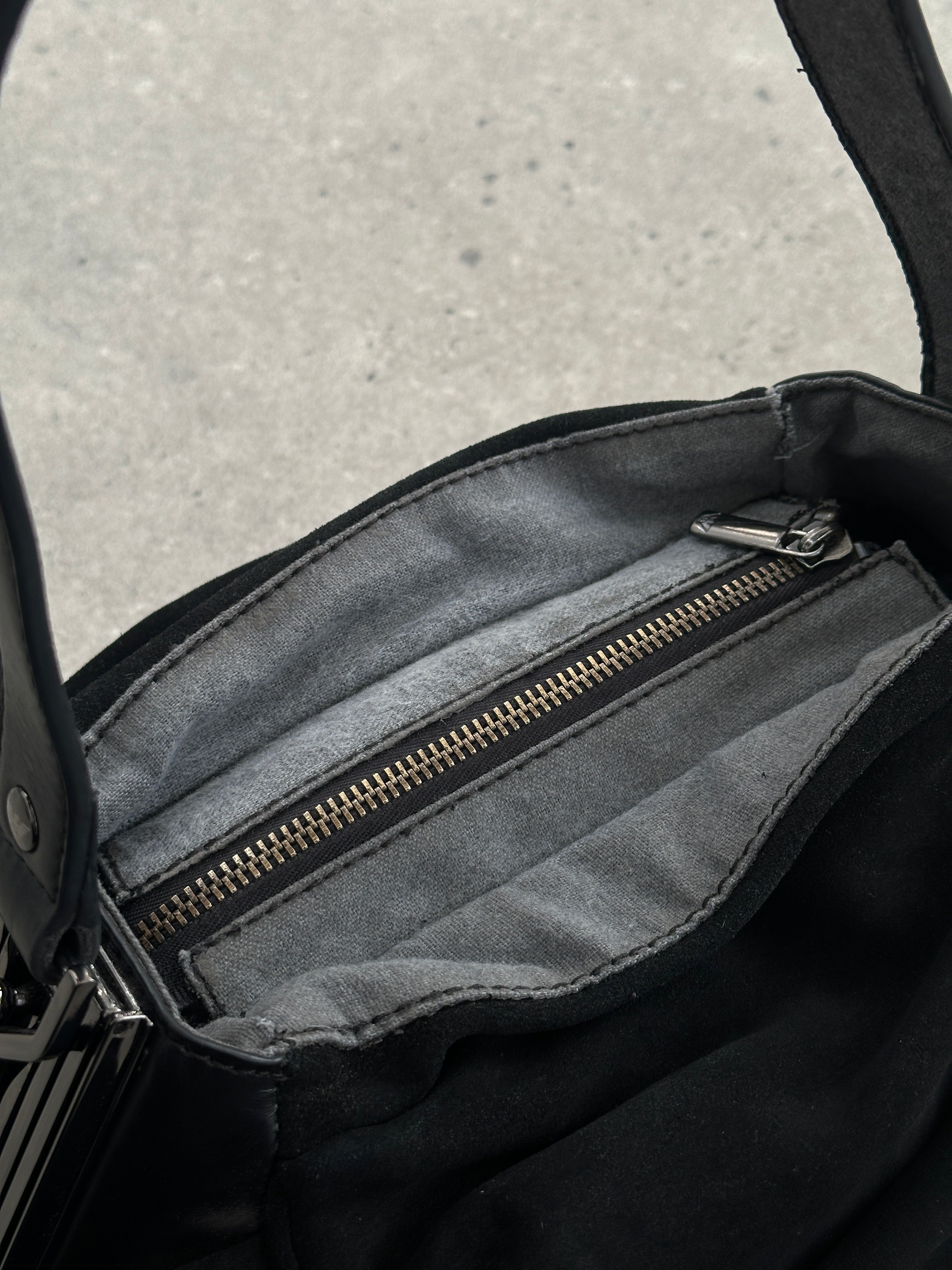 Armani Jeans suede ruched shoulder bag with a sleek design and adjustable strap, perfect for stylish everyday use.
