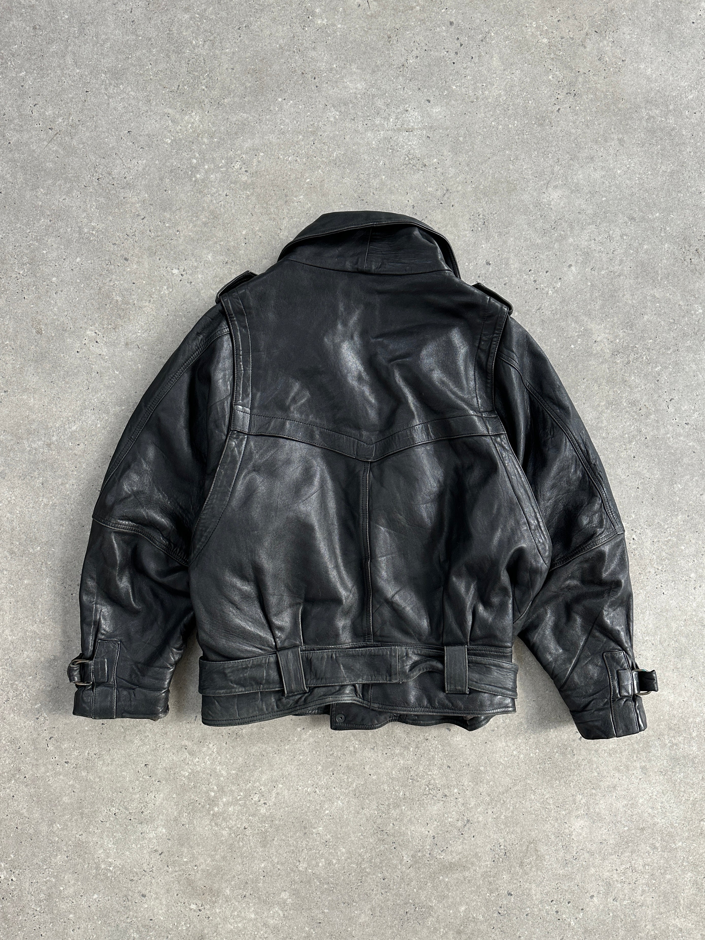 Vintage leather jacket with belted buckle design in XL size, featuring a classic distressed leather look and tailored fit.