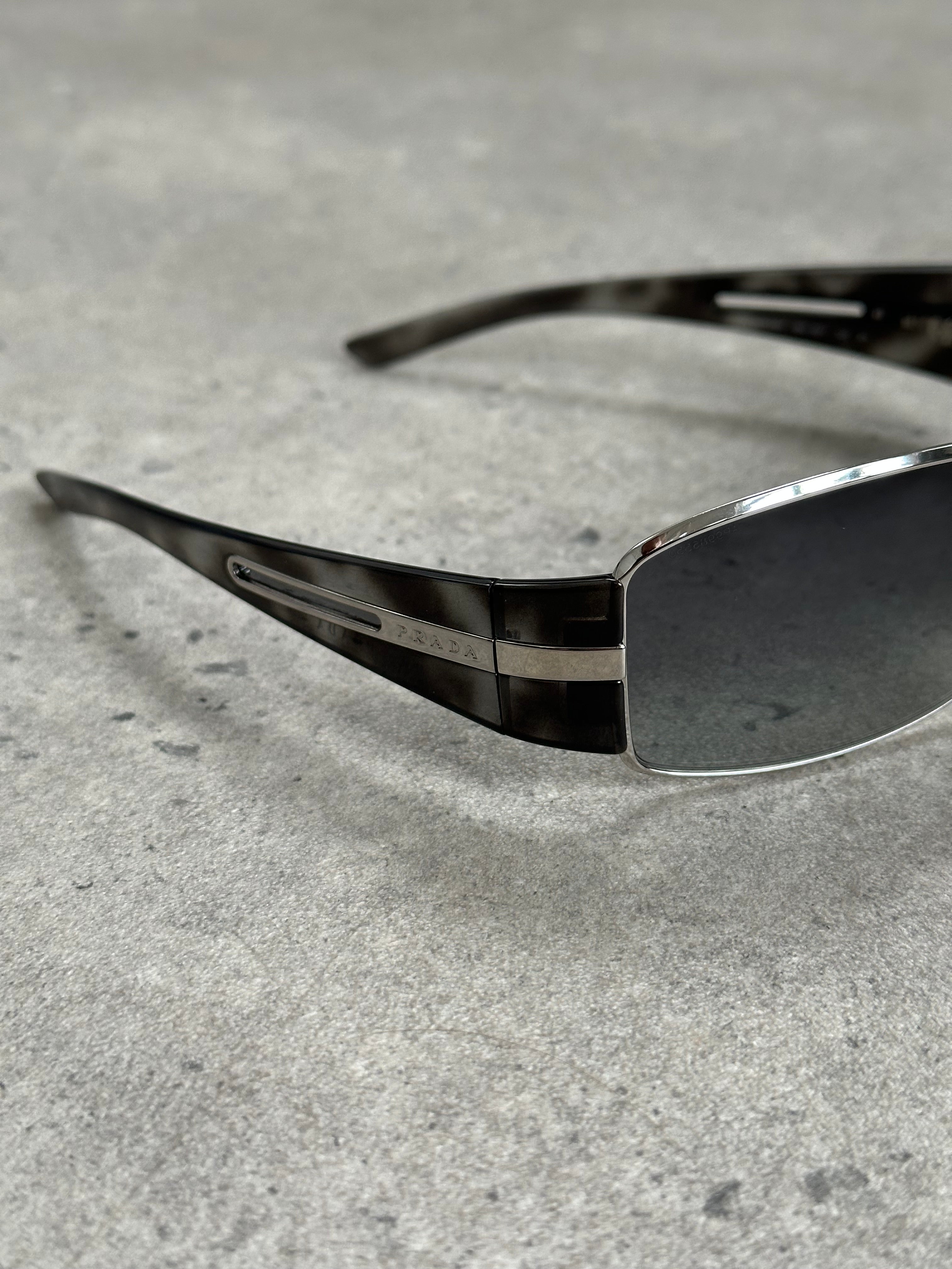 Prada 2000s aviator shield sunglasses with dark tinted lenses and metal frame, stylish and iconic eyewear.
