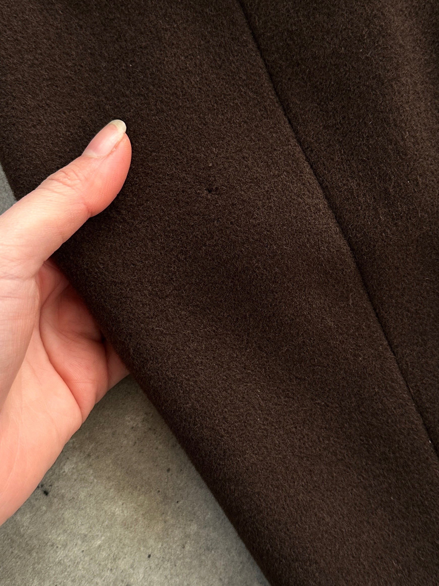 Marella virgin wool single-breasted belted coat in neutral color, tailored fit with wide lapels and front pockets.