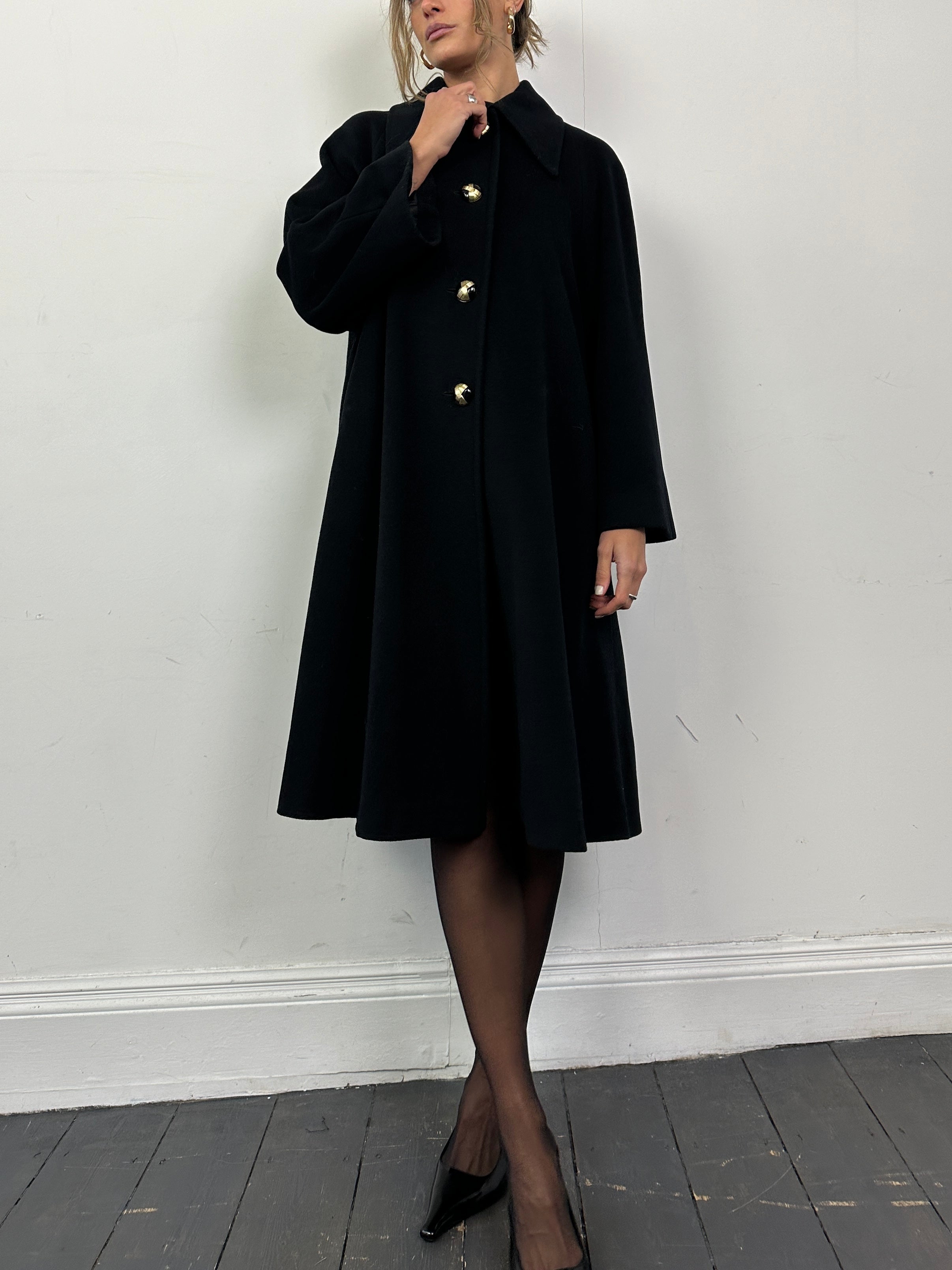 Vintage Italian wool A-line coat with dagger collar, in classic style, displayed in a natural pose.