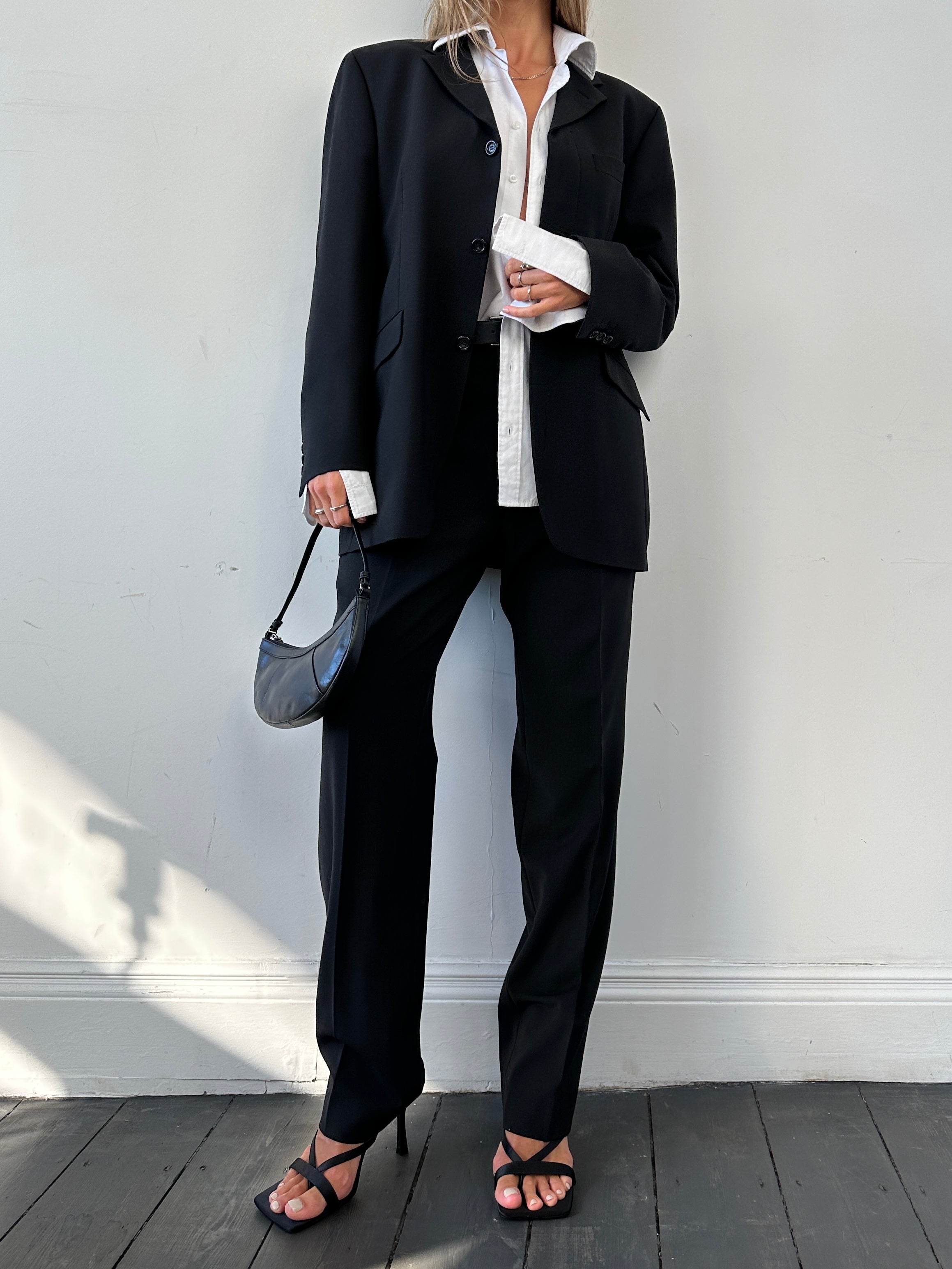 Vintage relaxed suit jumpsuit with concealed placket, in size 40R/L, featuring a vintage-inspired, comfortable design.