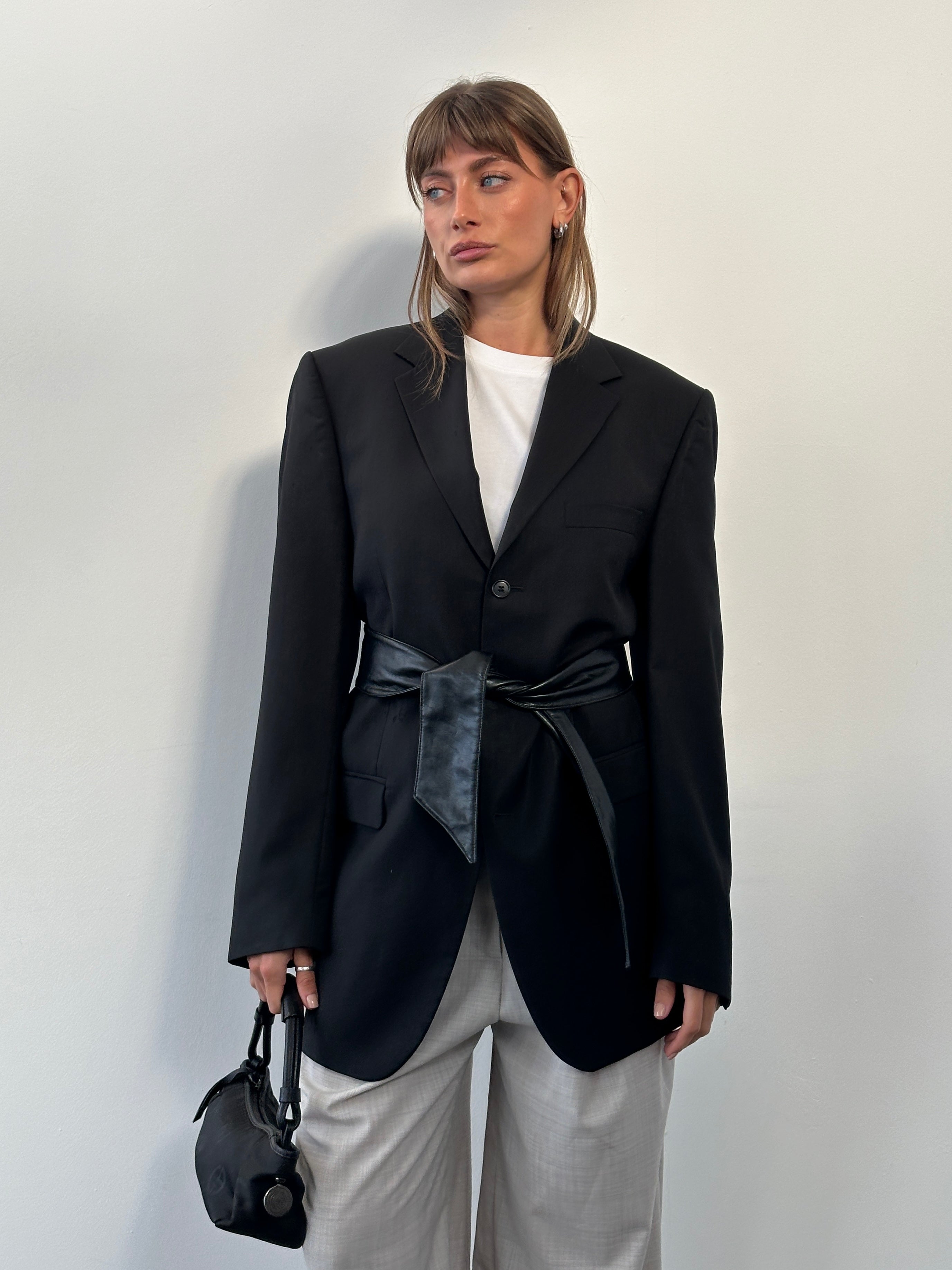 Yves Saint Laurent Pour Homme 1990s pure wool single-breasted blazer in size 40L/XL, shown on a hanger with a classic tailored fit.