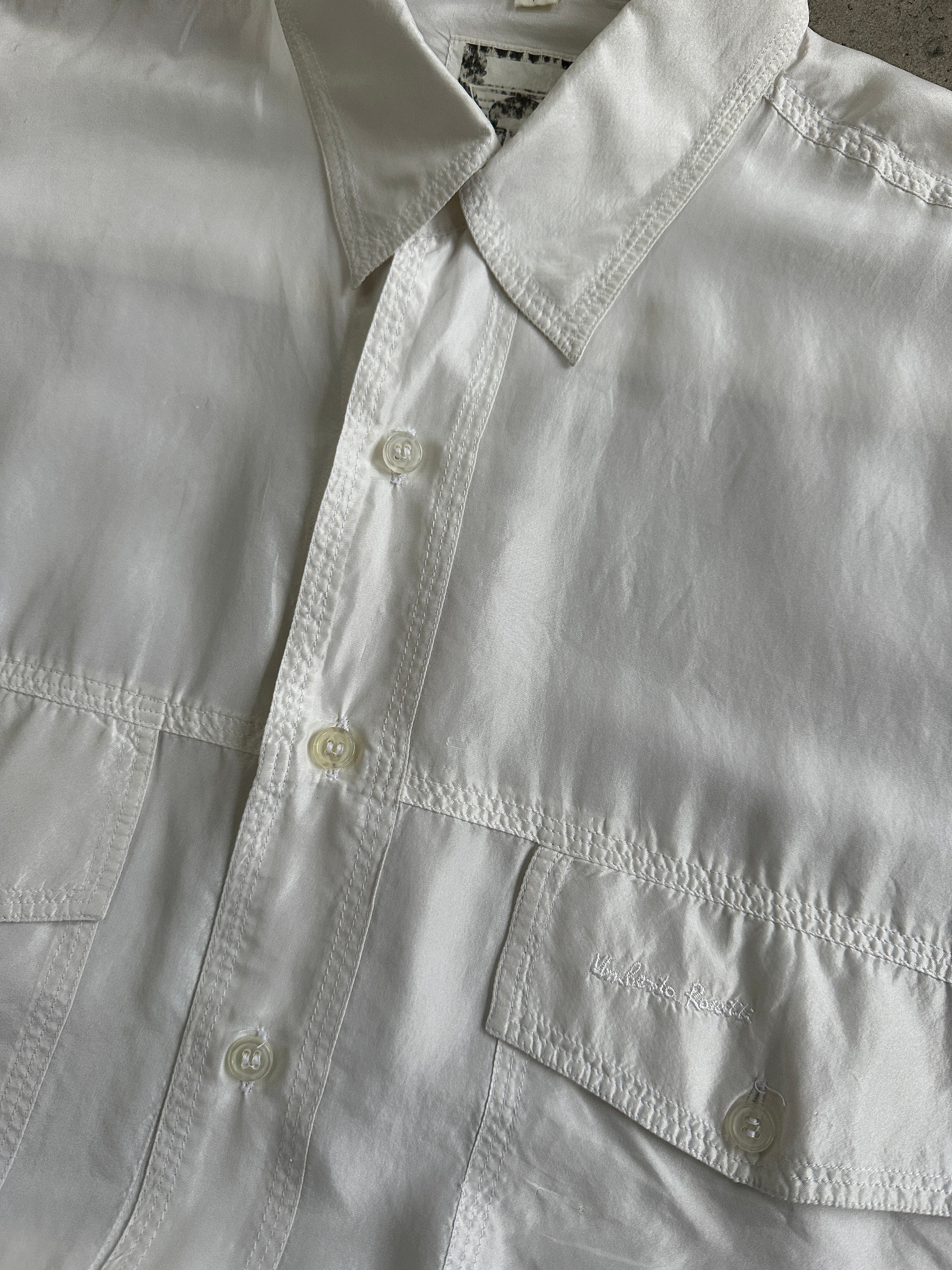 Vintage 1990s pure silk shirt in XL size, featuring a classic design and smooth fabric, displayed on a hanger.