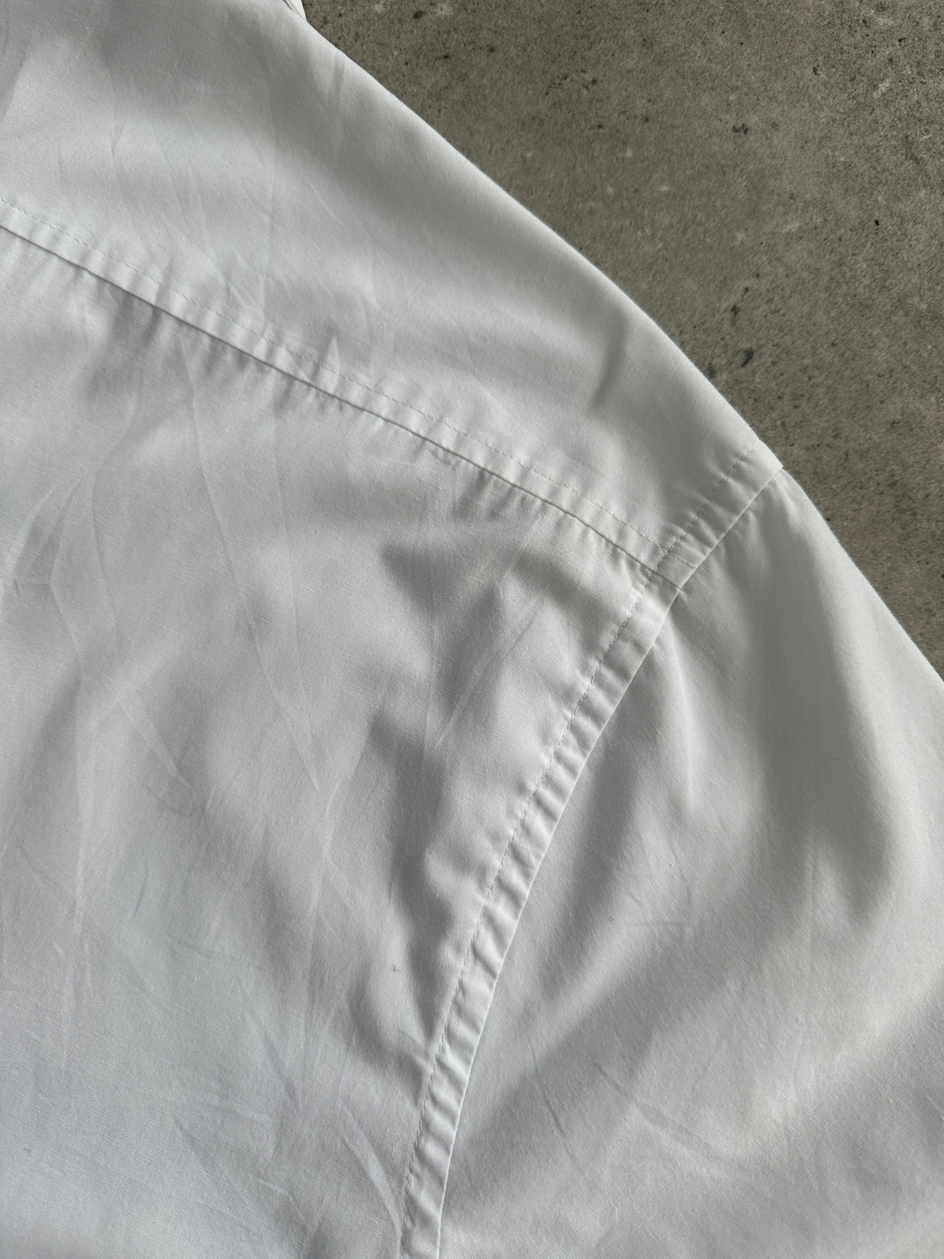 Yves Saint Laurent Pour Homme 2000s cotton short sleeve logo shirt in size L, featuring classic design and YSL branding.
