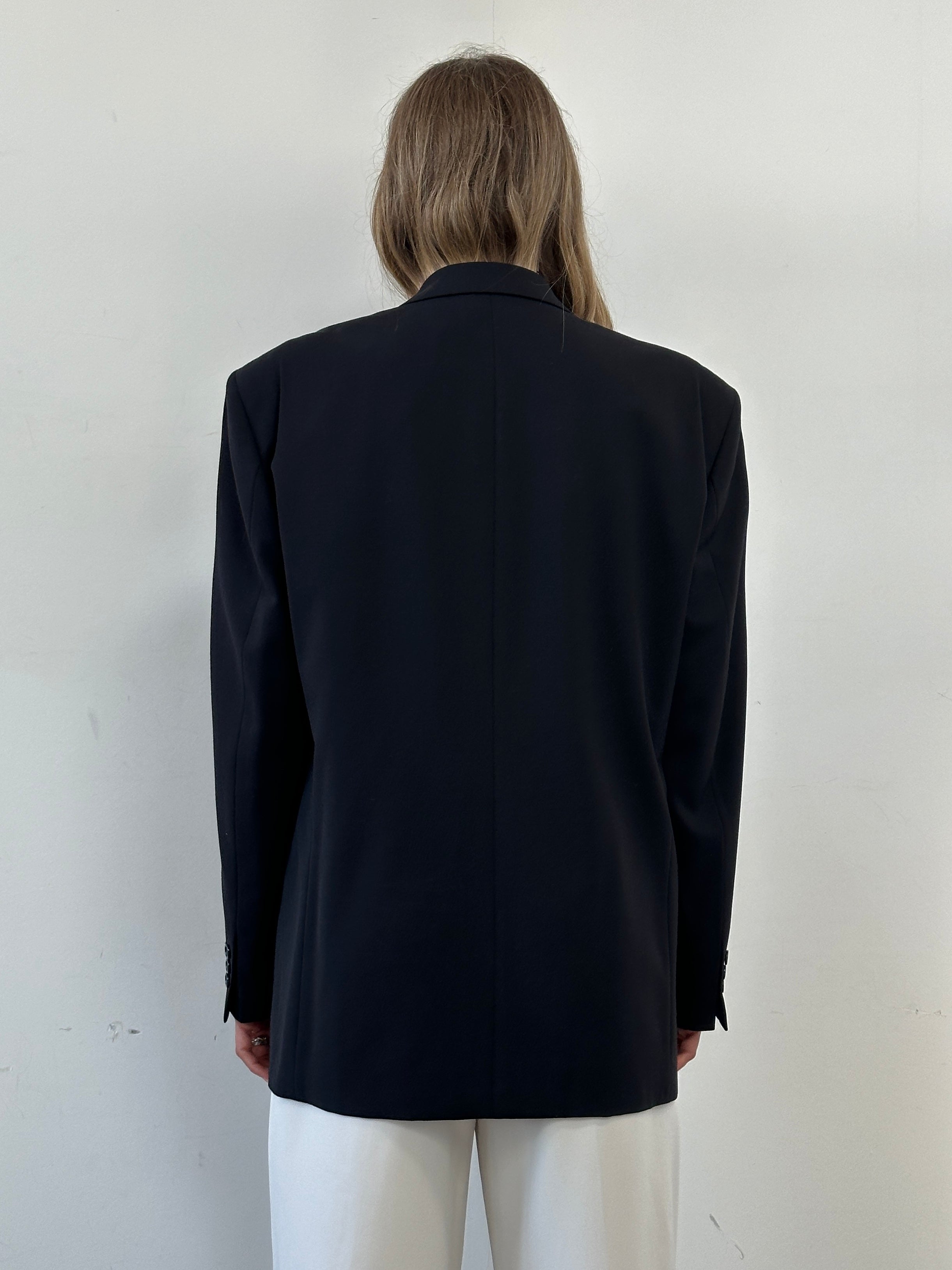 Vintage double-breasted wool blazer in size XL, featuring classic tailored design, dark fabric, and structured lapels.