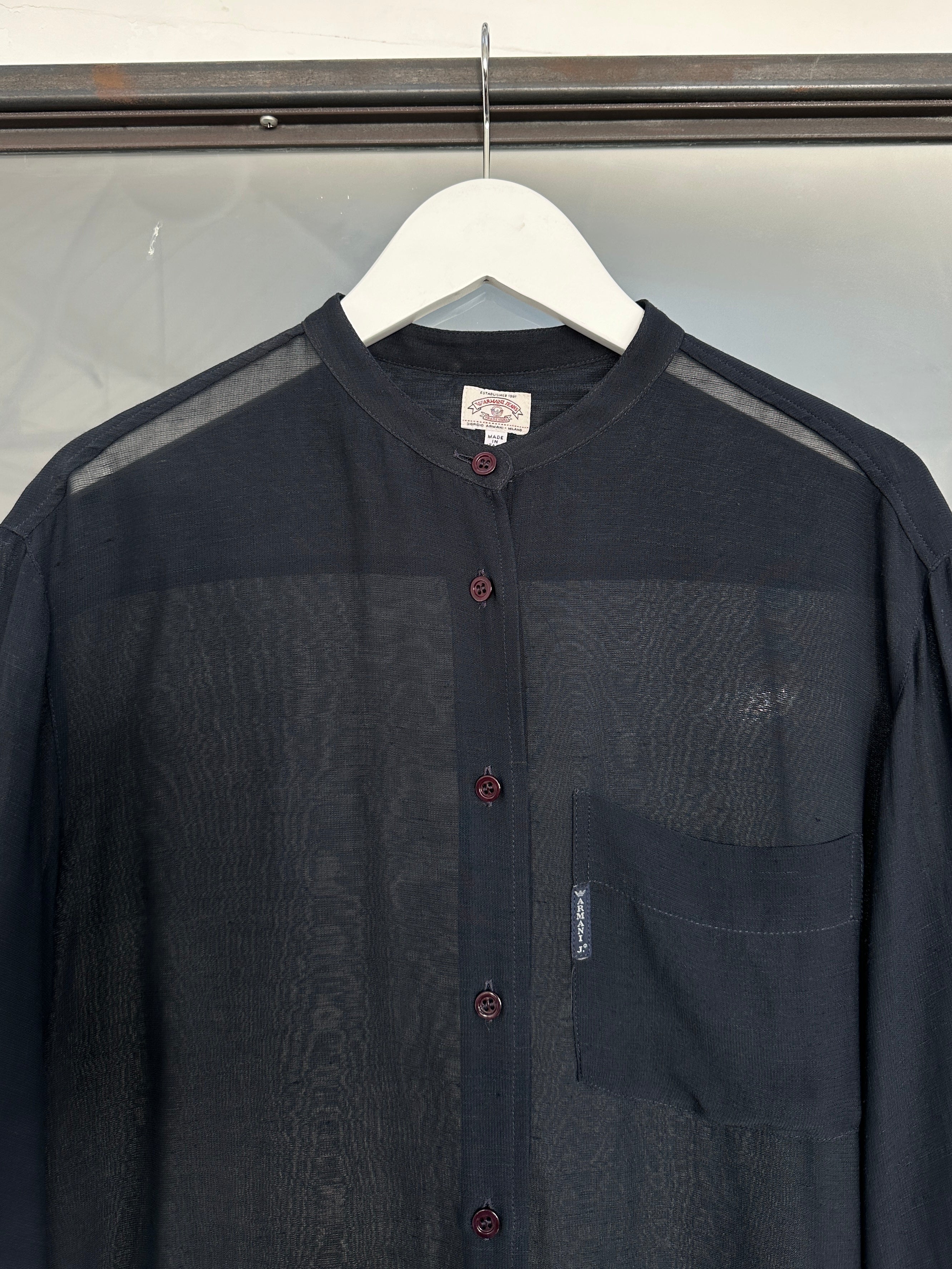 Armani Jeans 1990s sheer shirt in size M, featuring lightweight fabric and classic design, displayed on a hanger.