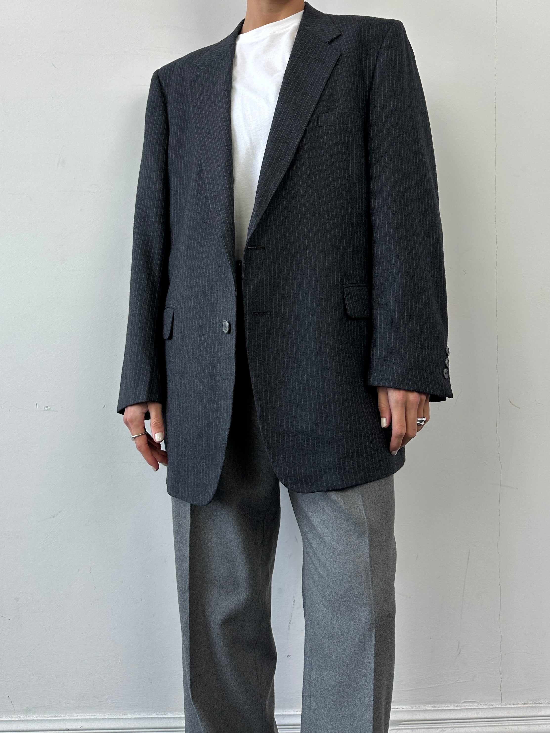 Givenchy pinstripe pure wool single-breasted blazer in size L/XL, showing tailored fit and classic lapel details.