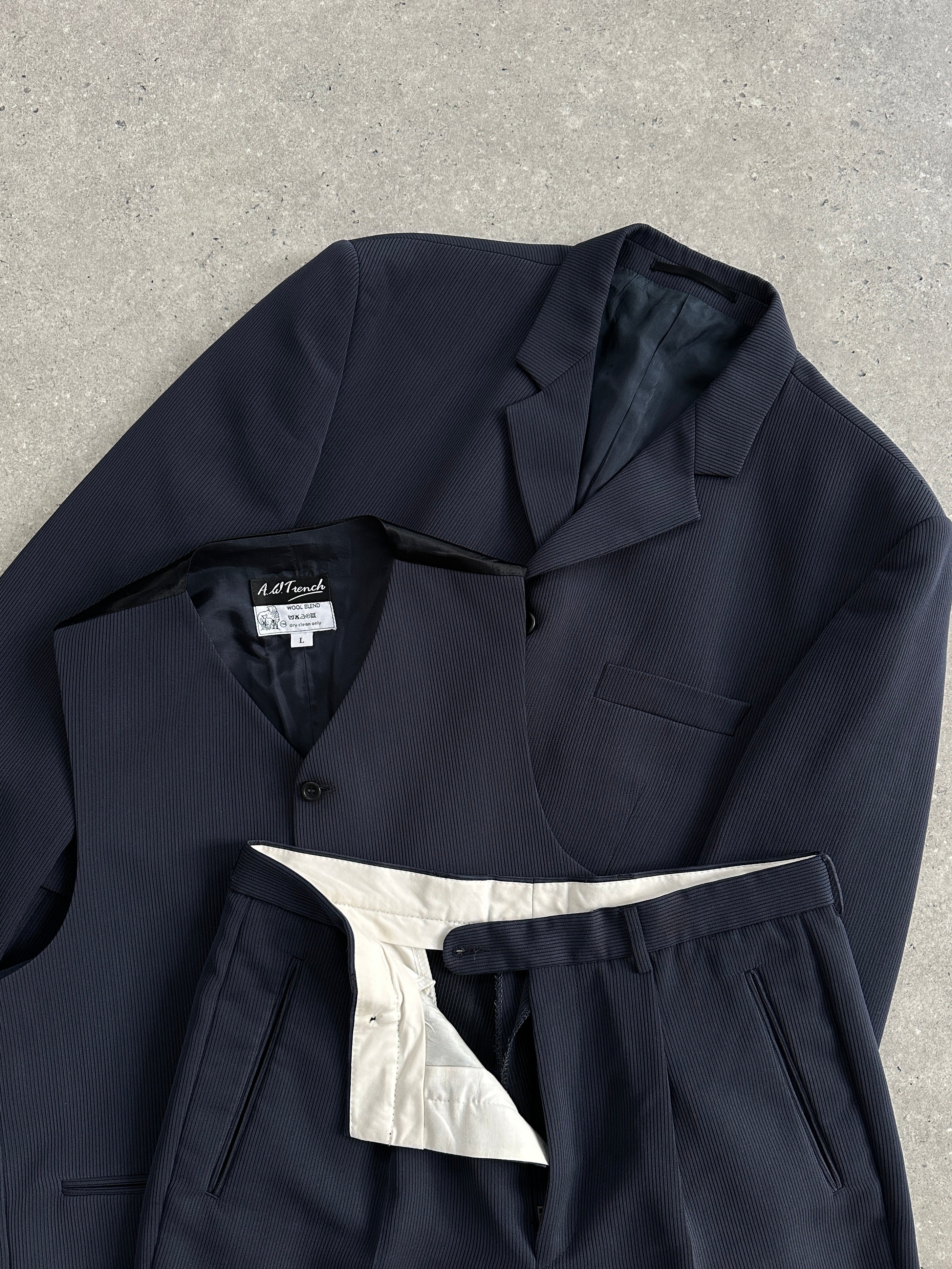 Vintage wool blend three-piece suit in size 40R/W32, featuring tailored jacket, vest, and trousers, ideal for formal occasions.