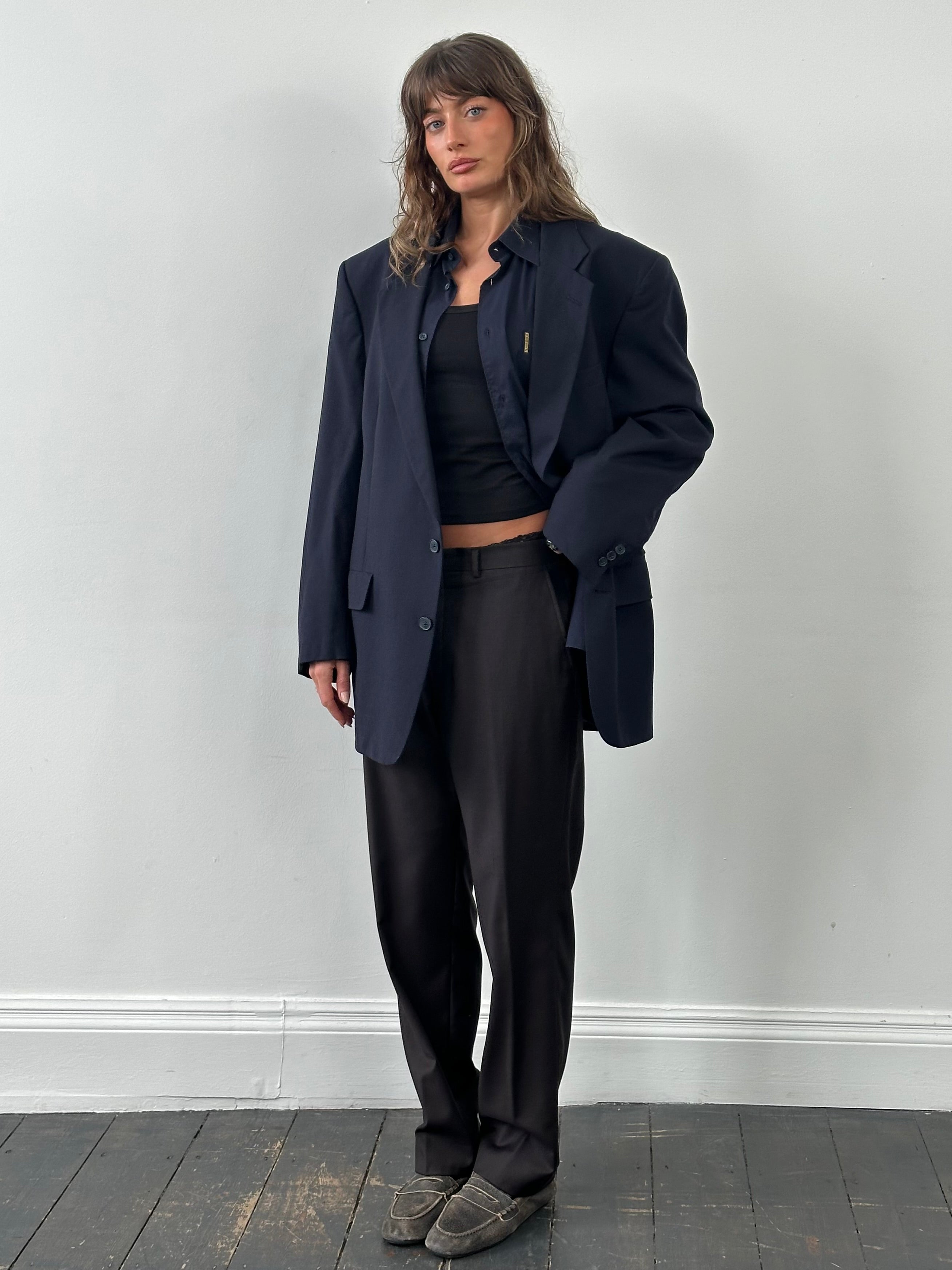 Christian Dior Monsieur 1980s pure wool single-breasted blazer in size 48L/XXL, navy blue with notch lapels and button closure.