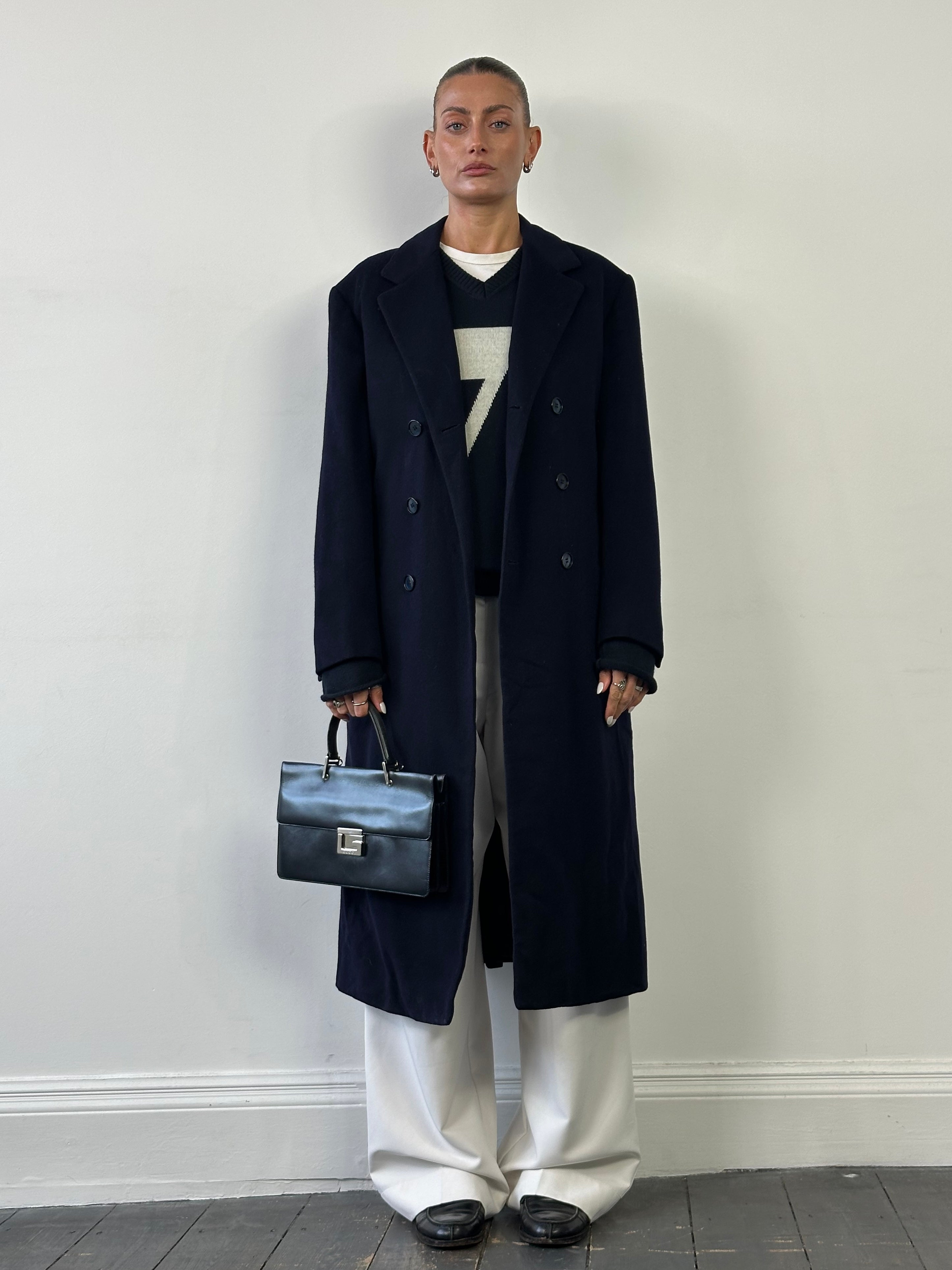 Vintage wool double-breasted floor-length coat in size S/M, featuring classic design and warm, textured fabric.