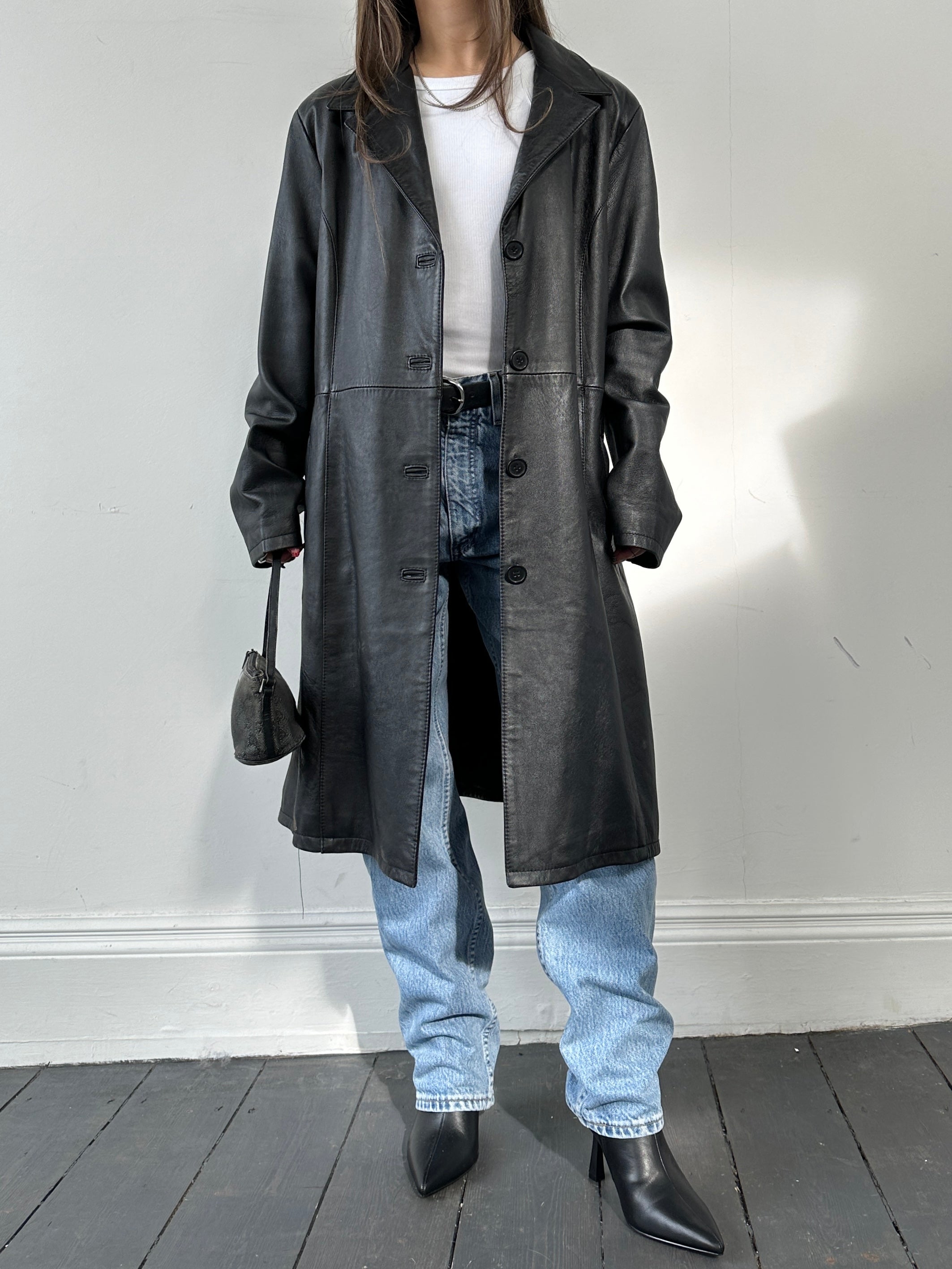Vintage Italian leather jacket in size S, stylish vintage leather coat with classic design and rich texture.