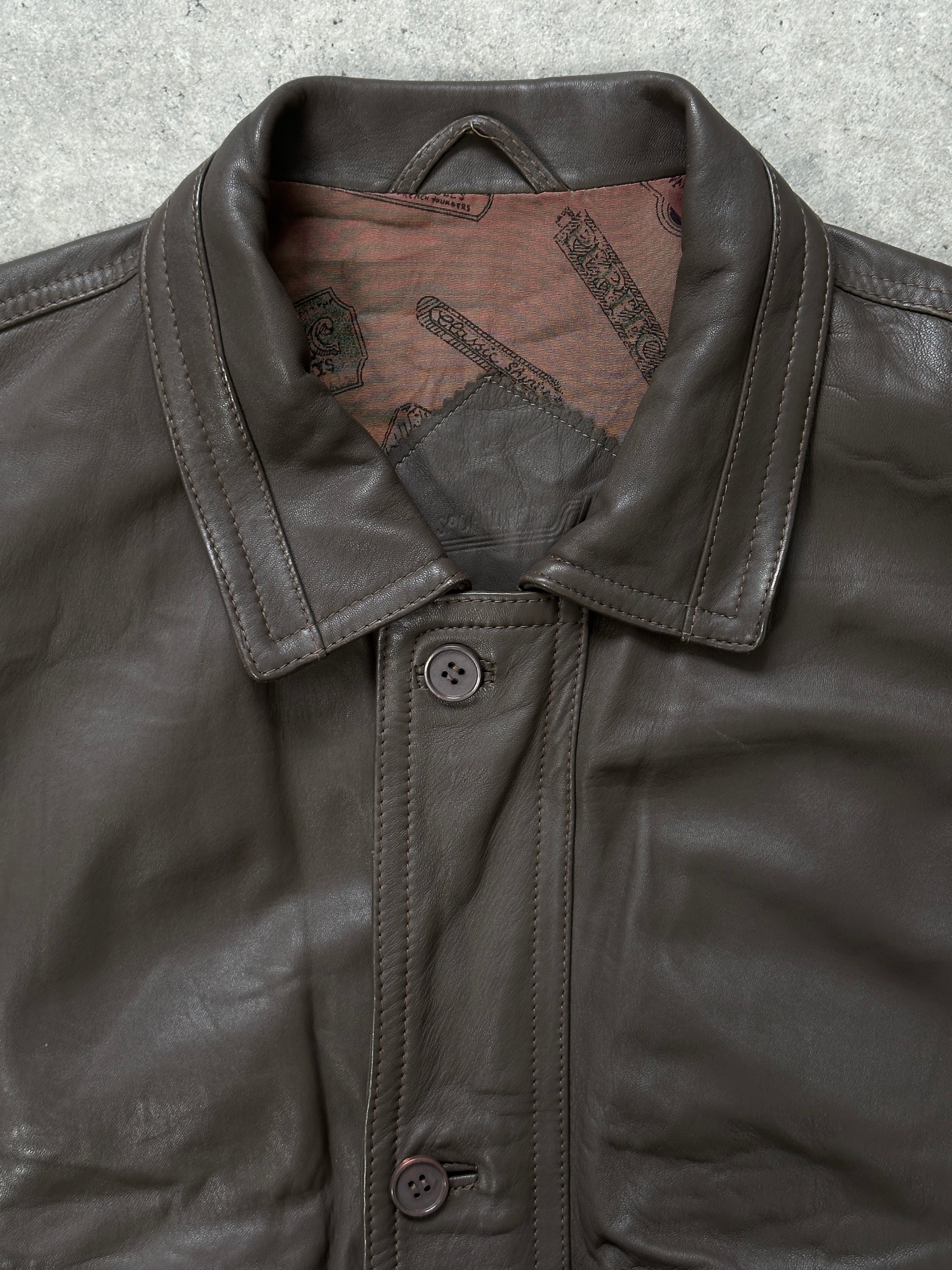 Vintage 1990s leather bomber jacket in size M, featuring classic design and brown leather material.