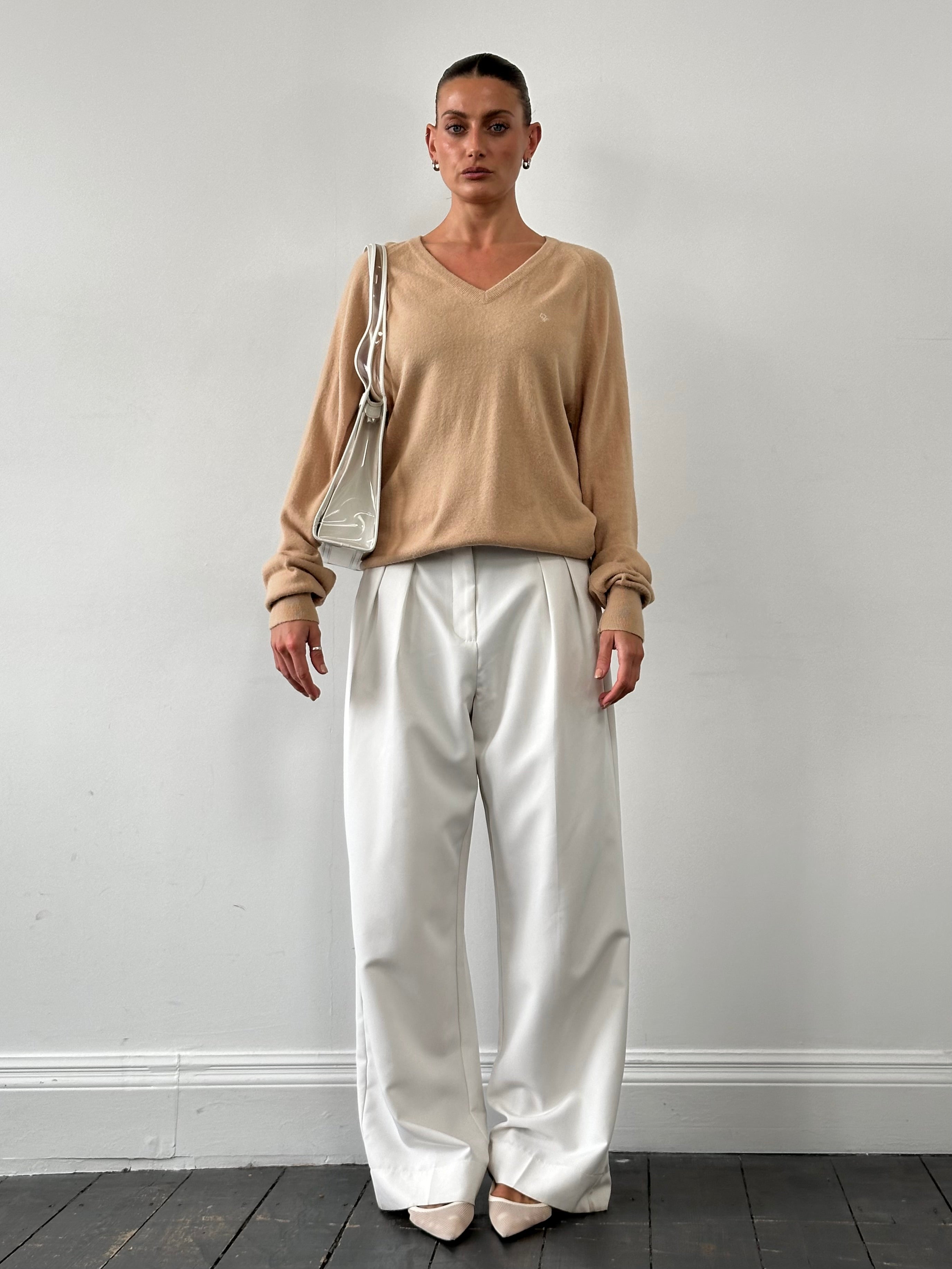 Christian Dior 1980s V-neck logo knitted jumper in size L, featuring classic Dior branding and a cozy knit texture.