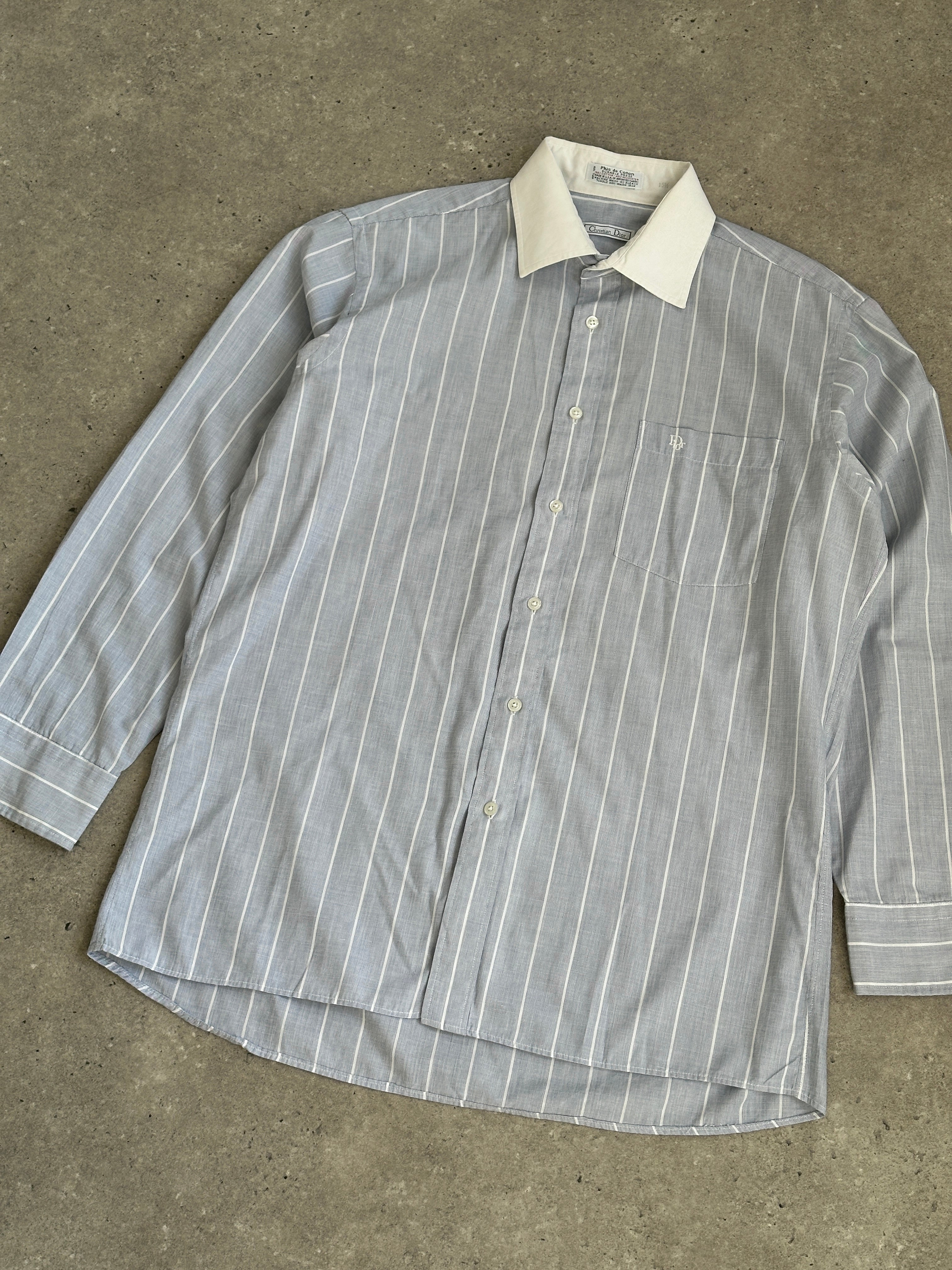 Christian Dior men's logo shirt with stripe contrast collar, featuring elegant design and button-front detail.