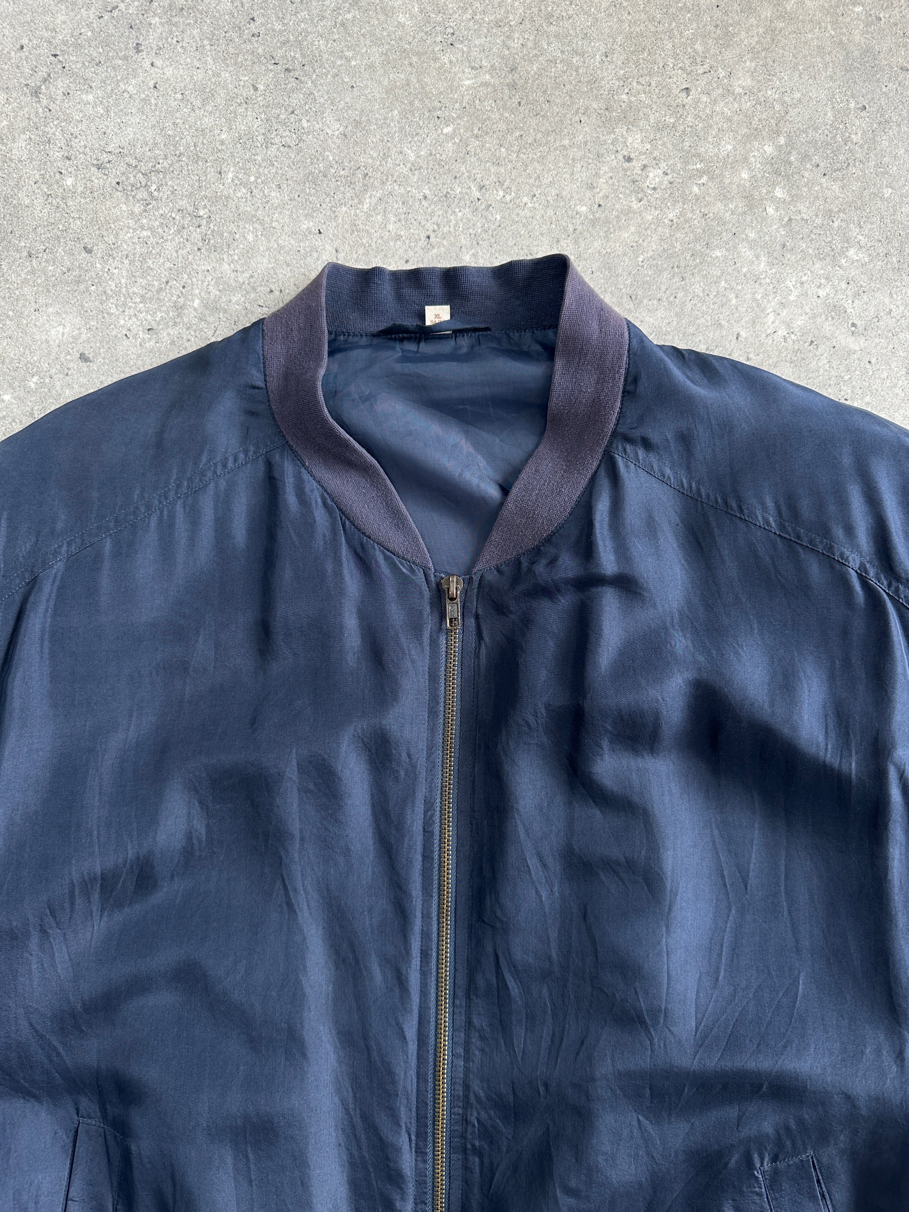 Vintage 1980s pure silk bomber jacket in XL/XXL, classic design with a shiny silk finish and ribbed cuffs and collar.