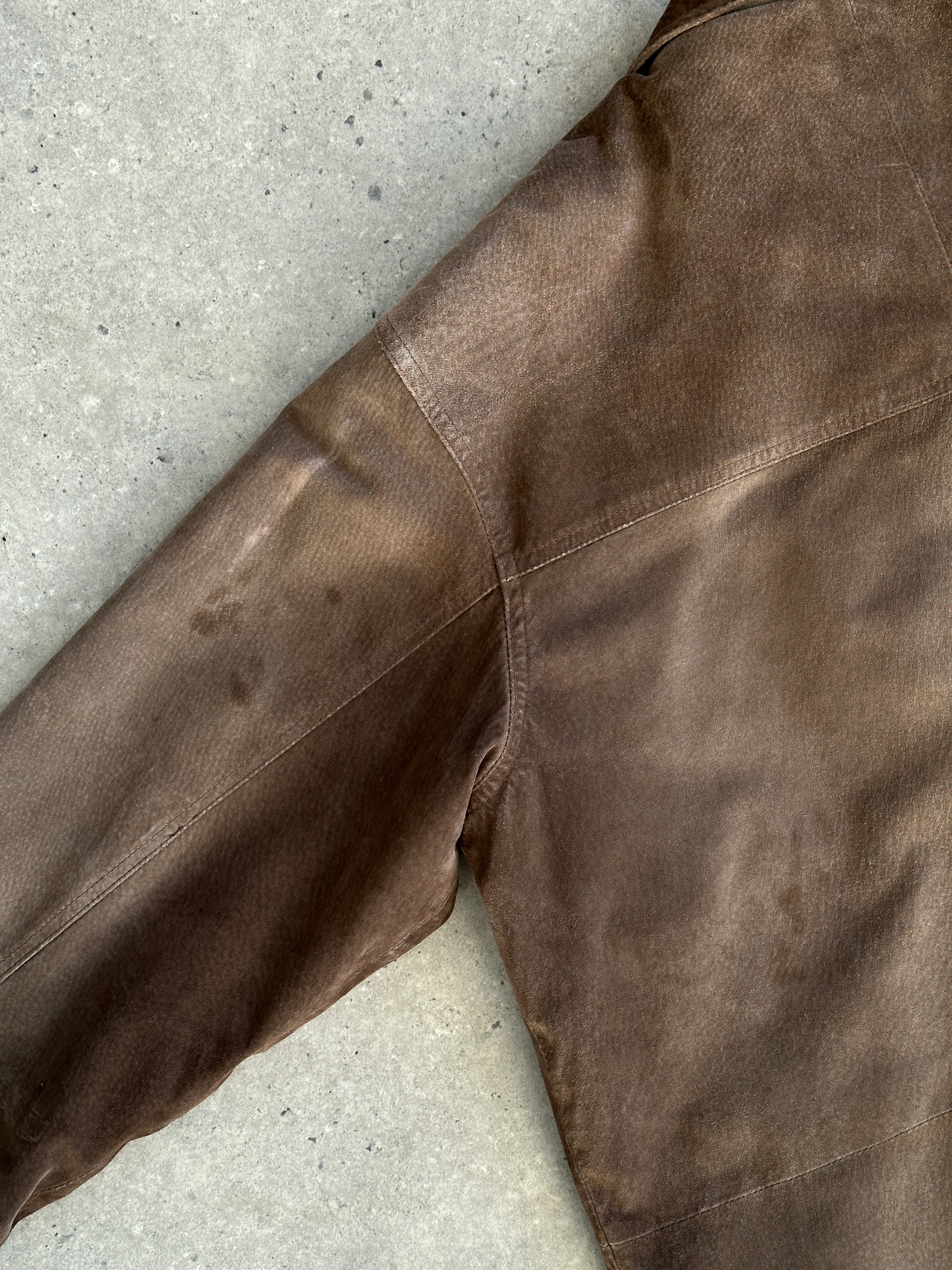 Vintage suede leather jacket in XL/XXL size, featuring classic design and rich texture, displayed on a hanger.