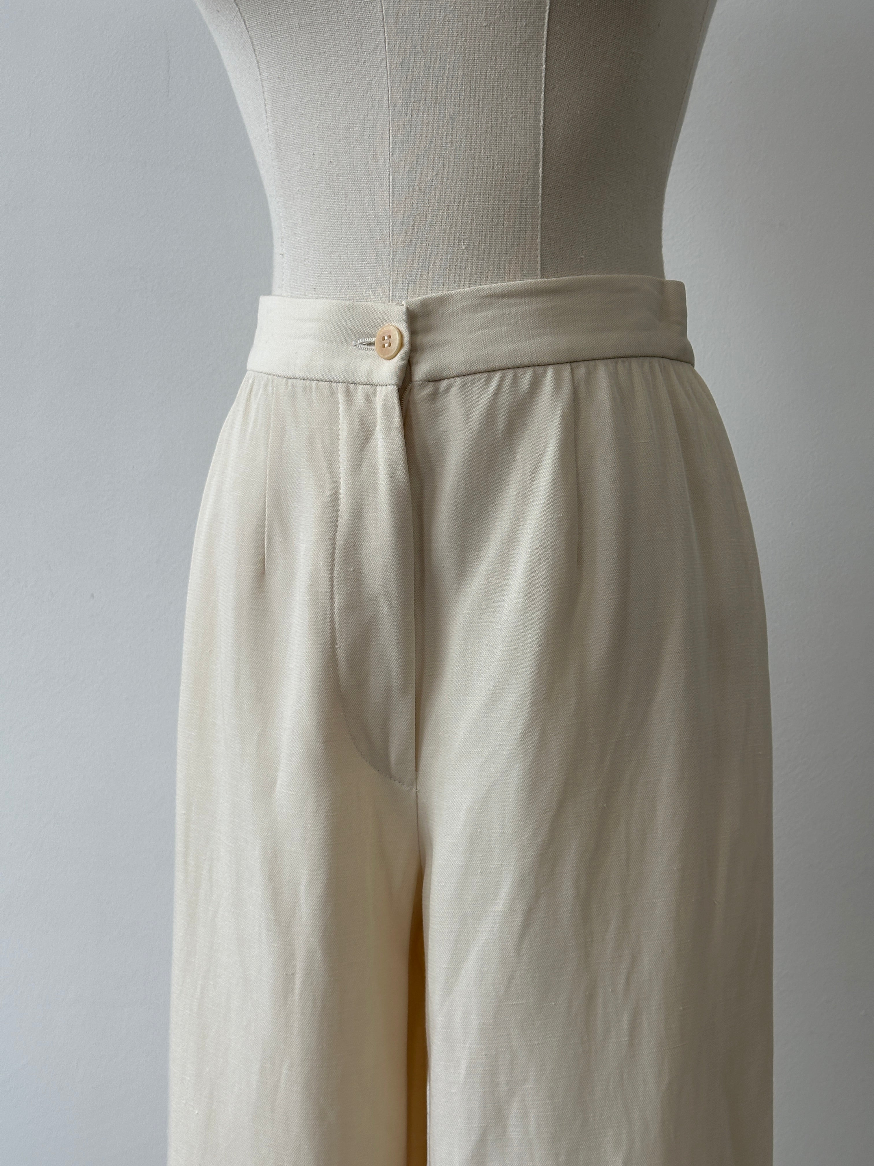 Giorgio Armani 1990s wide-leg tailored trousers in black with high waist and classic fit, size W28, made from smooth fabric.