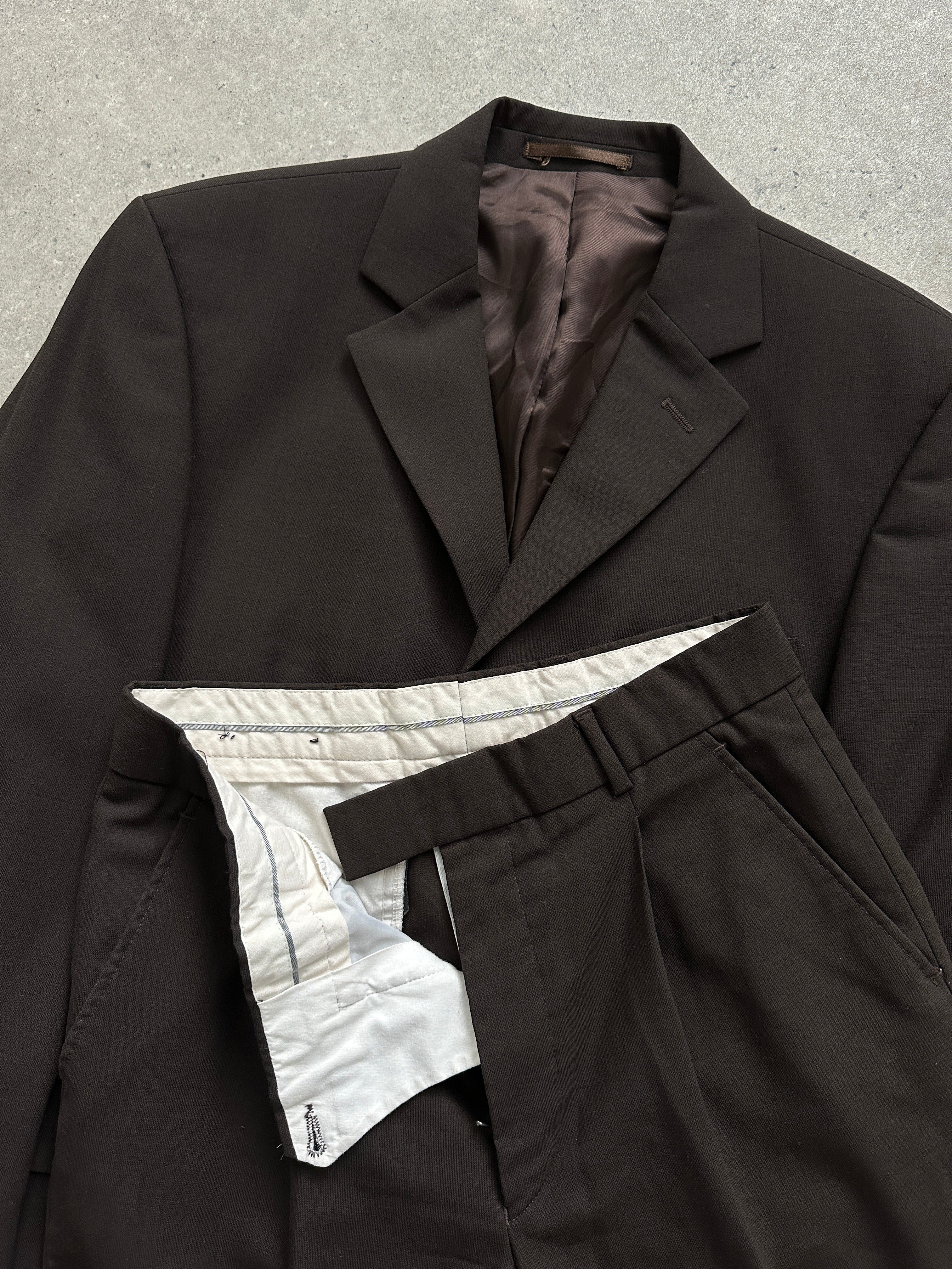 Vintage wool single-breasted jumpsuit in size 38R/W28, featuring a classic tailored fit and vintage-inspired design.
