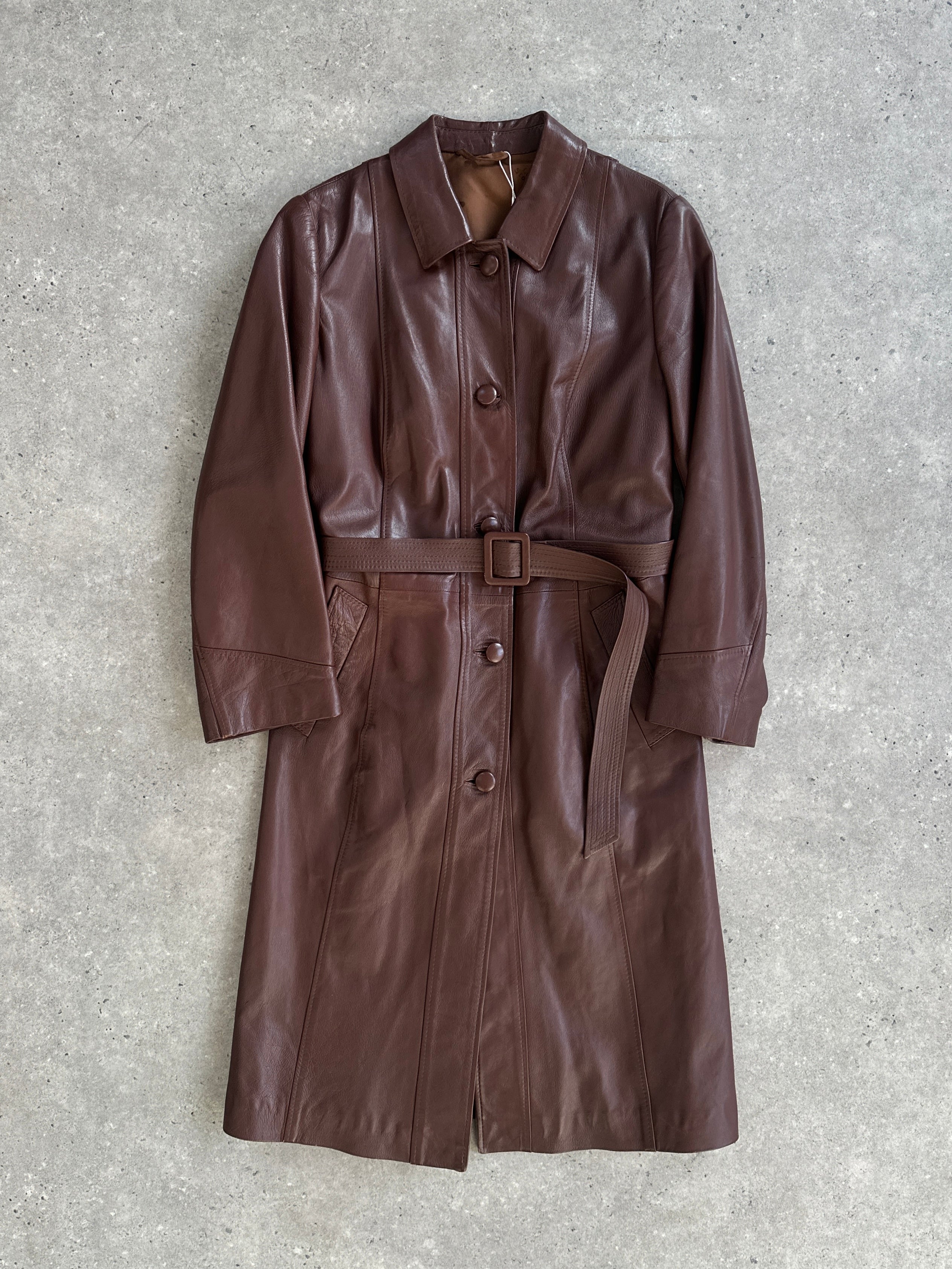 Vintage brand smooth leather belted trench coat jacket in size M/L, featuring classic design and button details.