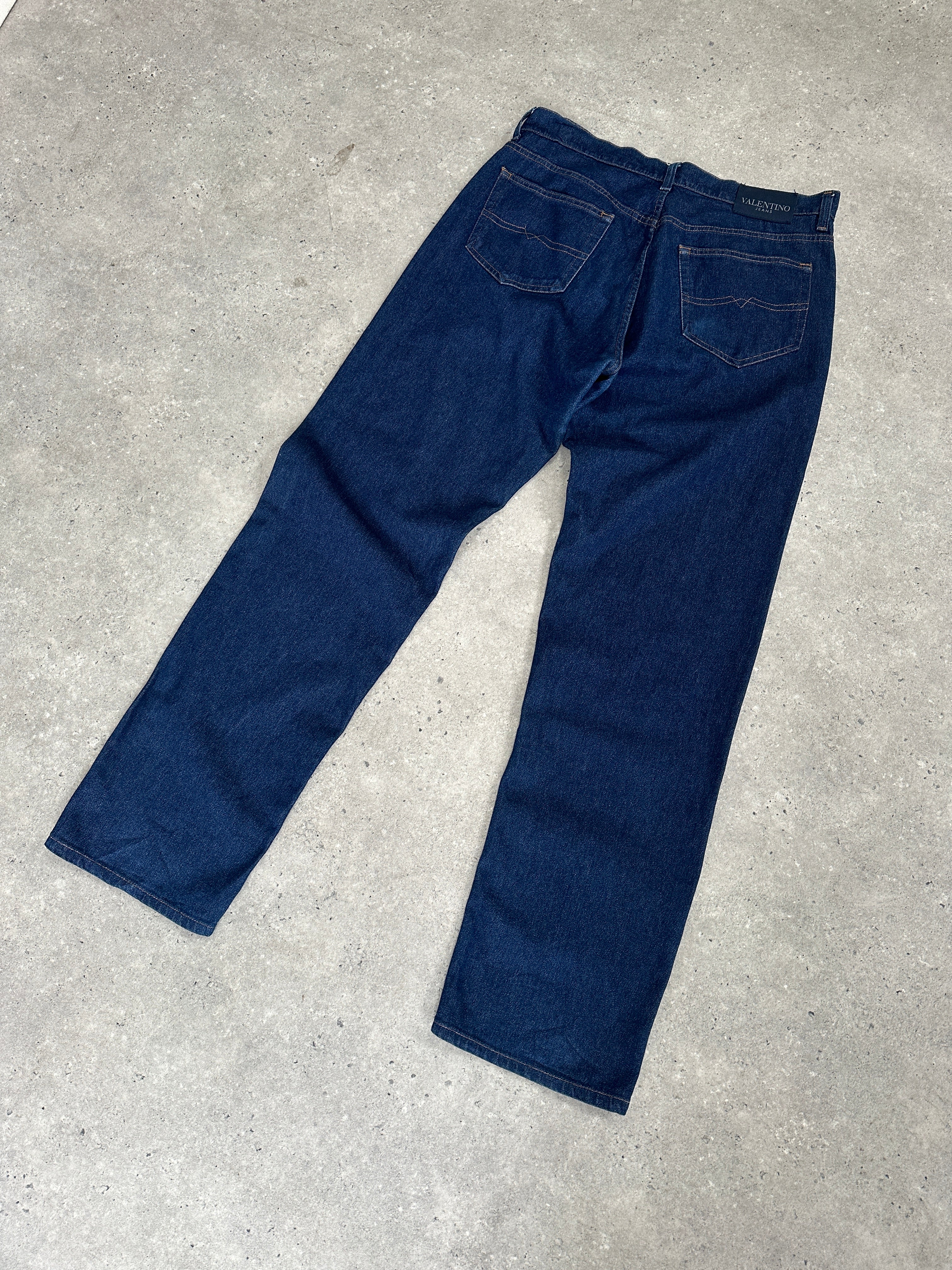 Valentino high waisted straight leg denim jeans in W34, showcasing classic blue denim with a fitted waistband and clean stitching.