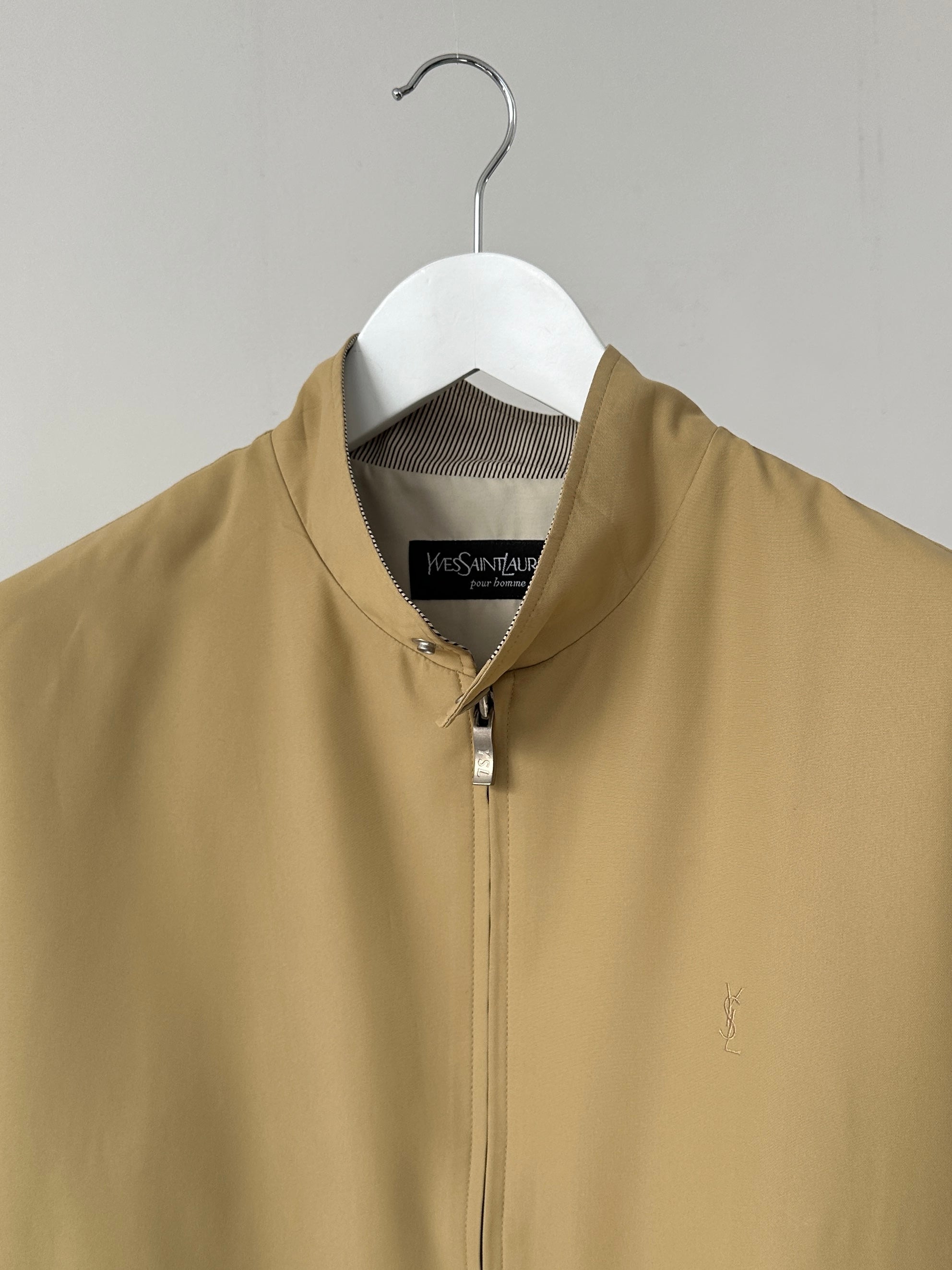 Yves Saint Laurent logo bomber jacket in size M/L, black with branded front and ribbed cuffs, stylish and modern outerwear.