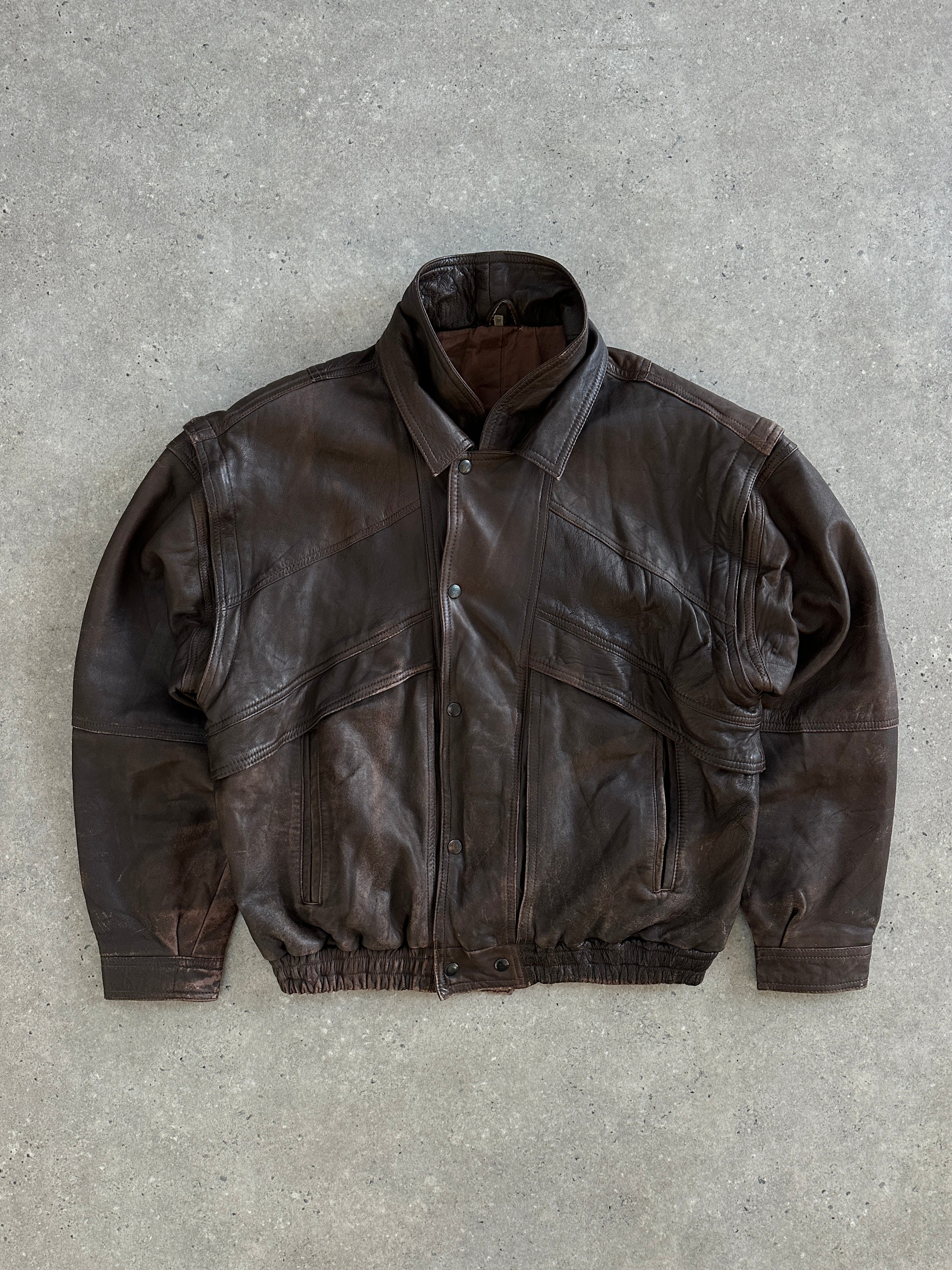 Vintage 1990s aged double collar leather bomber jacket in size XL with distressed finish and classic design.