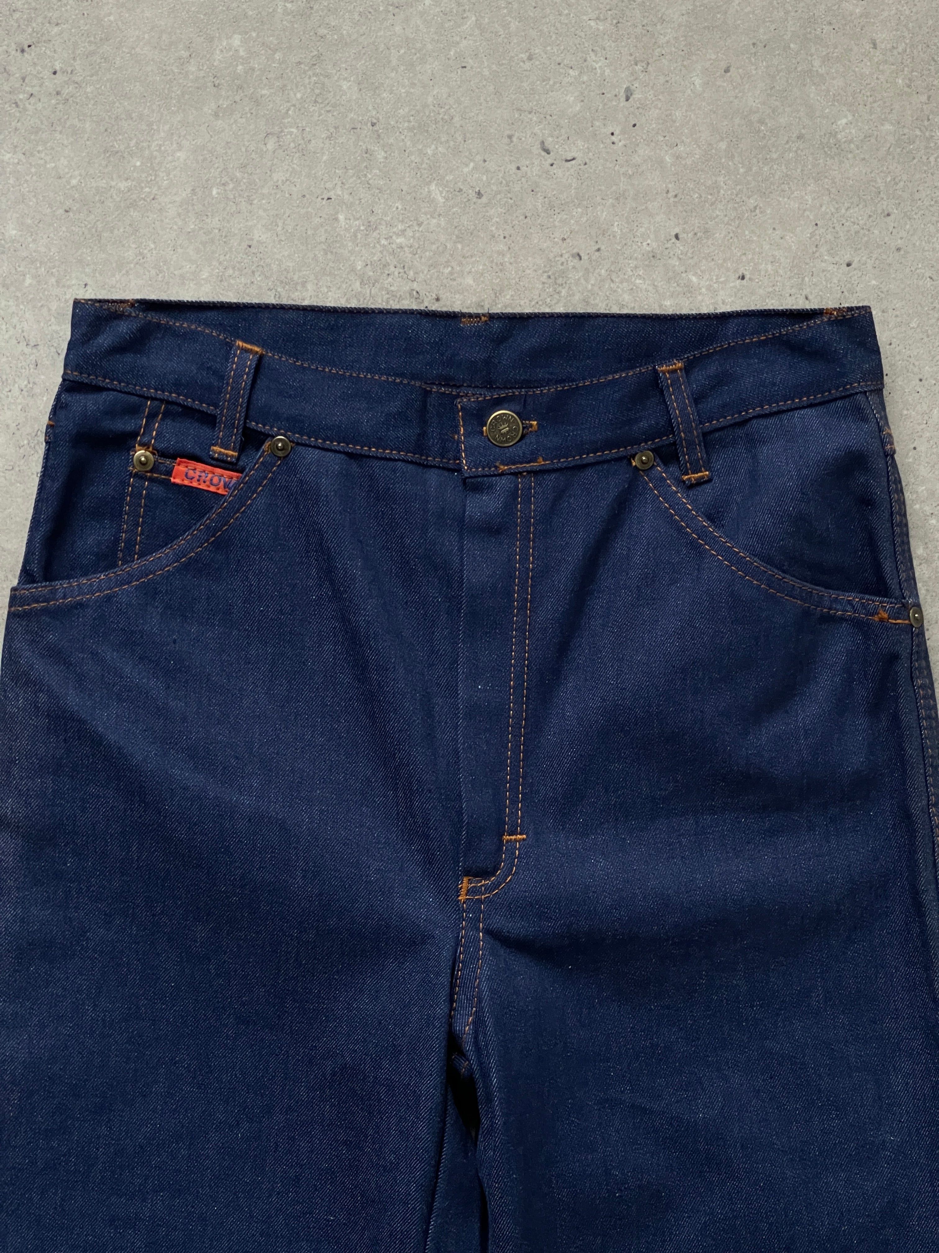 Vintage Italian 1990s straight leg high-waisted denim jeans in size W28, showing classic blue wash and vintage style details.