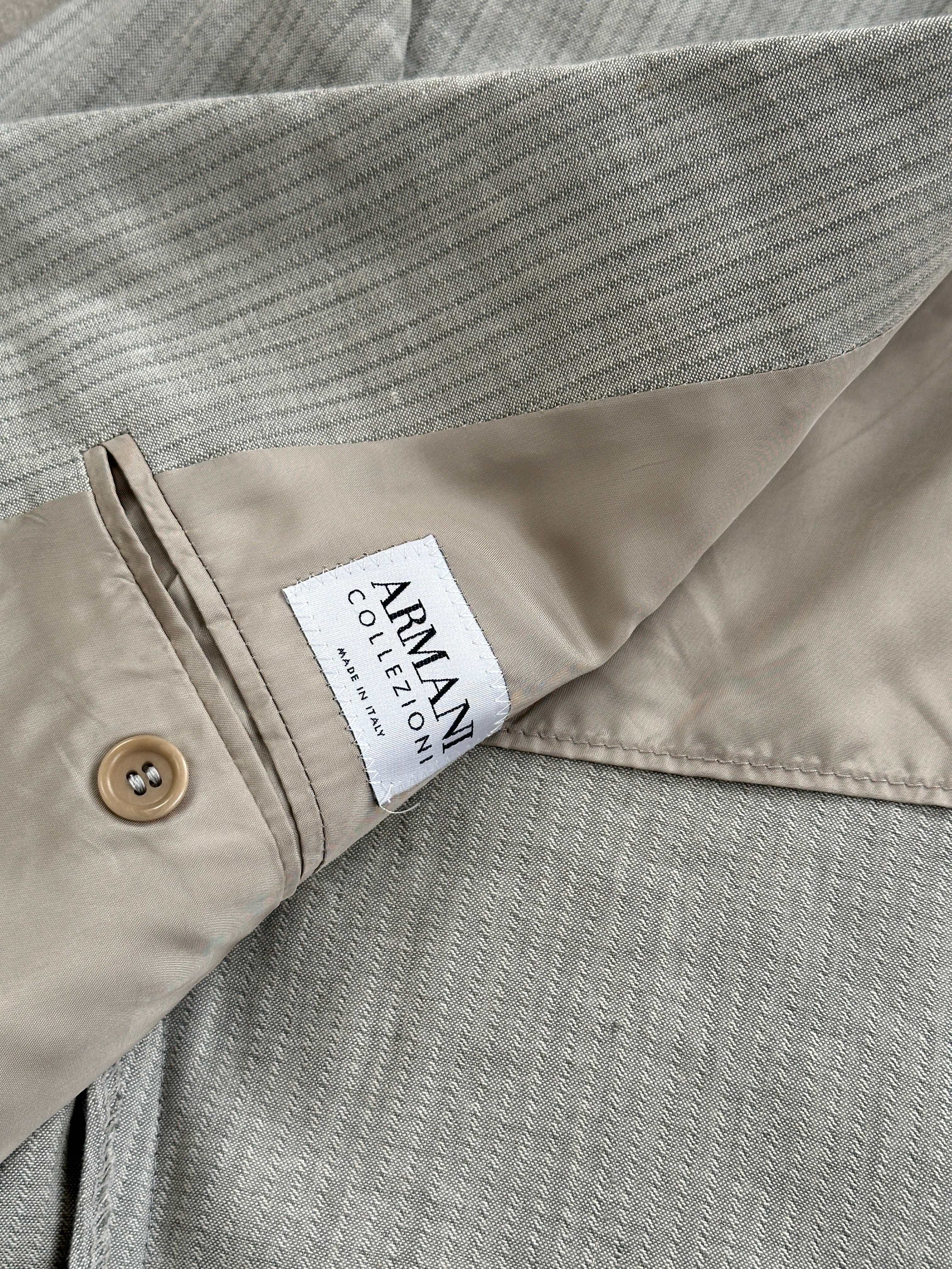 Armani Collezioni striped linen and cotton blazer in a relaxed fit, size 42R/XL, featuring a tailored collar and button closure.