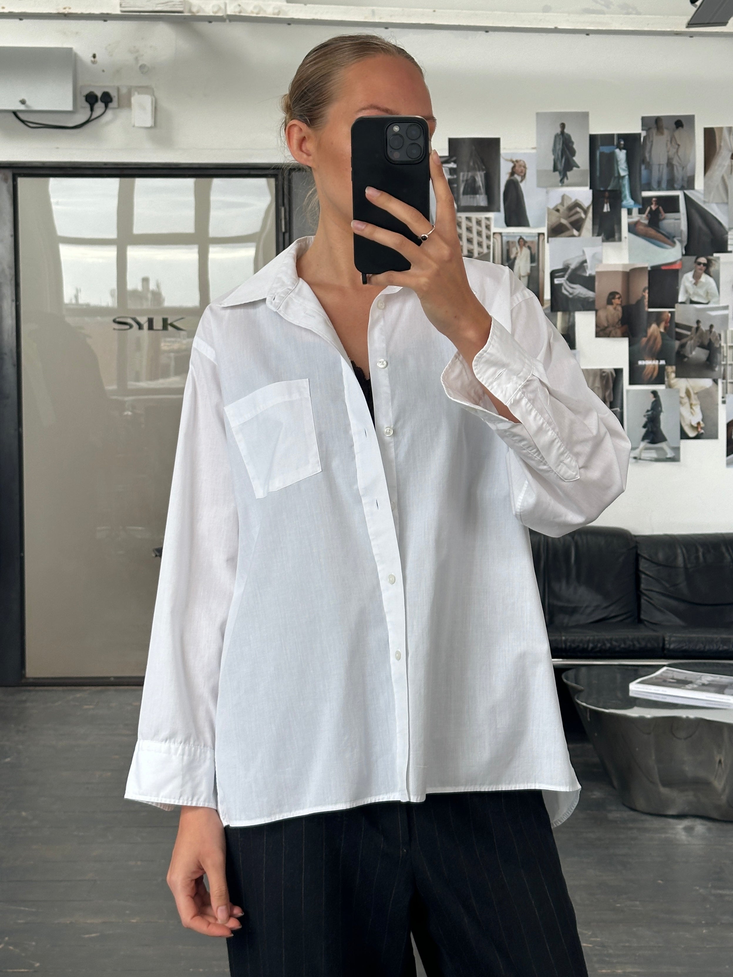 Christian Dior 1980s cotton shirt in size M/L, featuring classic design and soft fabric, displayed on a hanger.
