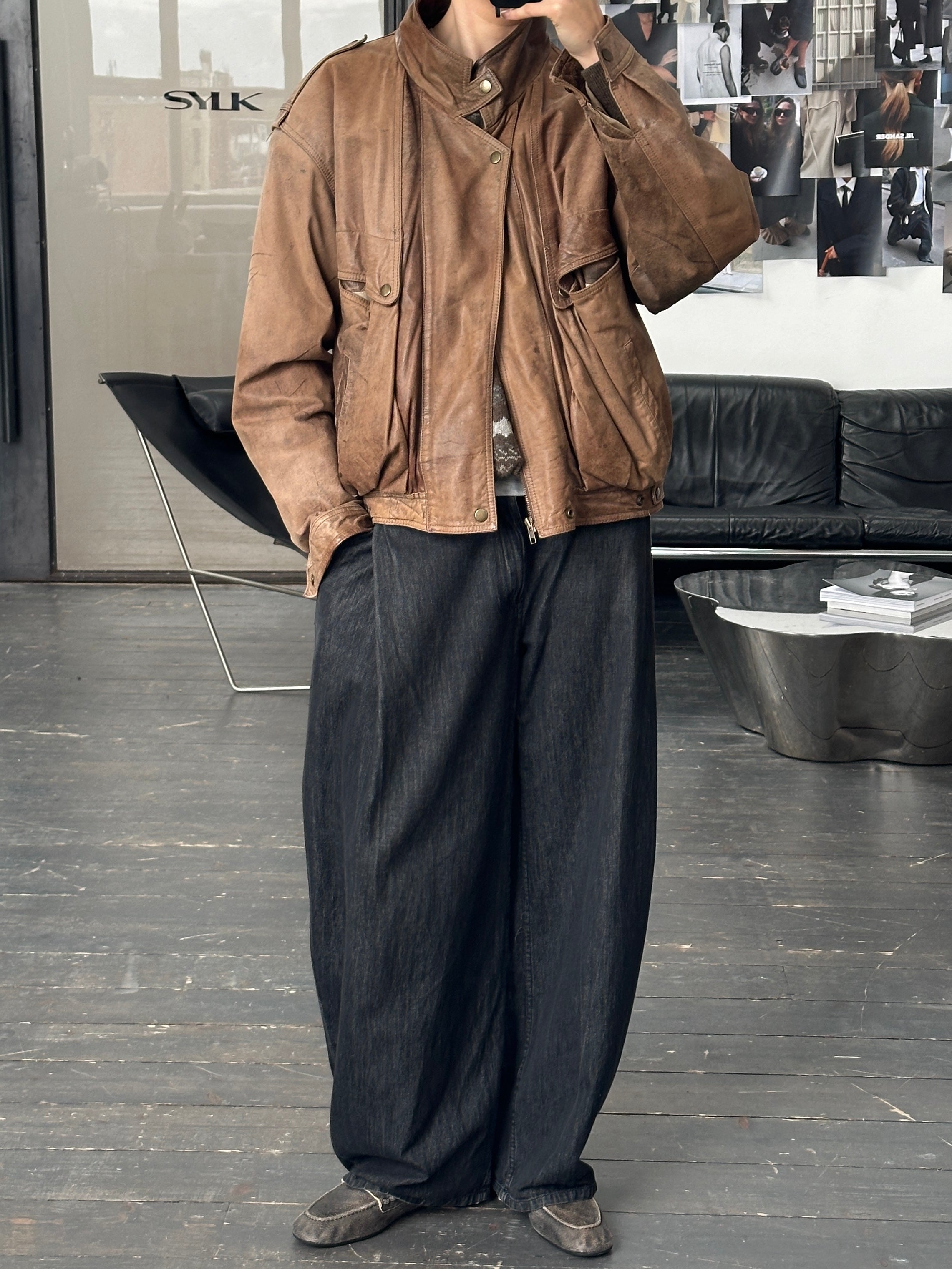 Vintage 1990s high neck leather bomber jacket in aged leather, featuring a classic vintage style and M/L size.