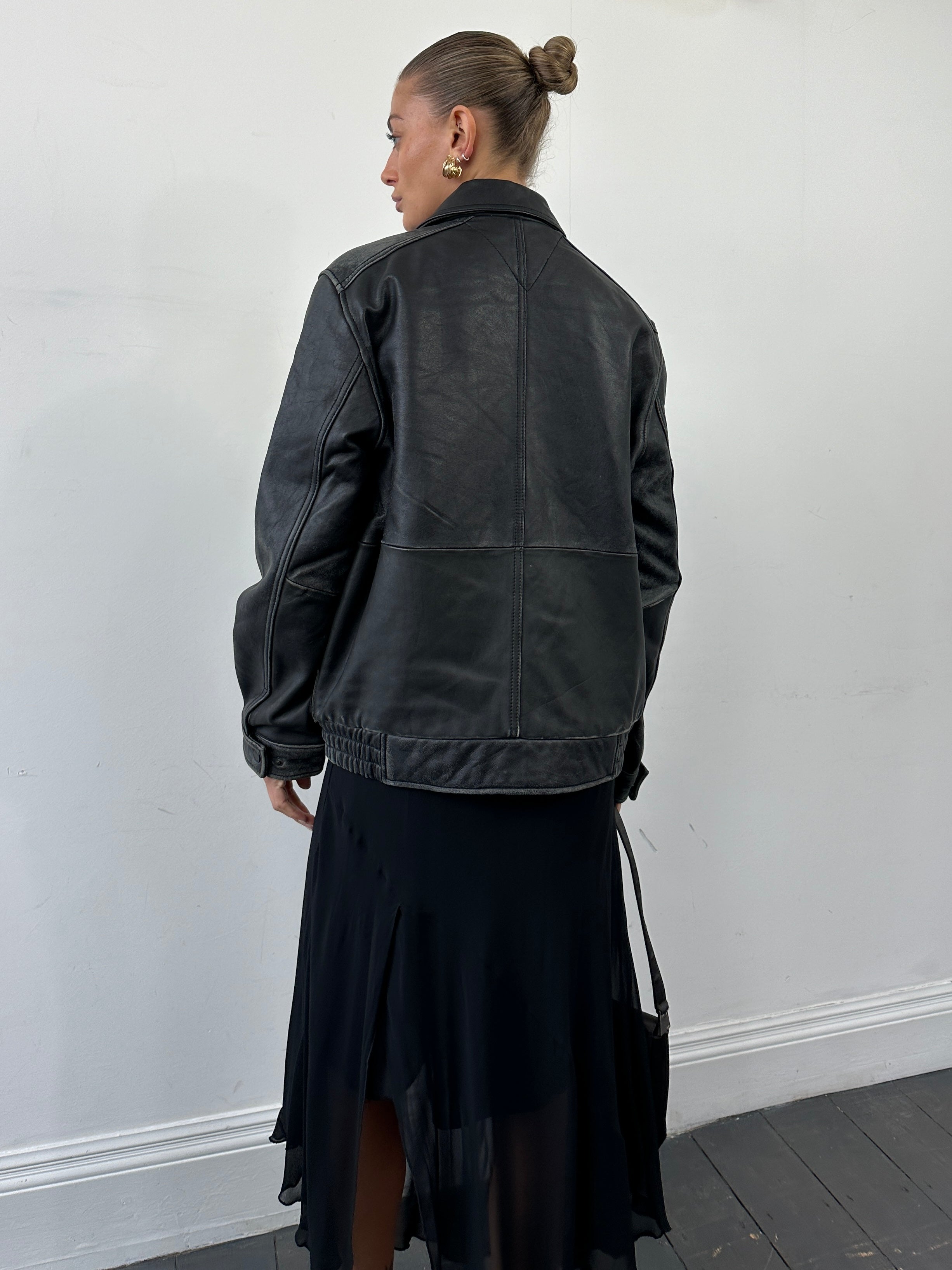 Tommy Hilfiger distressed leather bomber jacket in size M with a classic fit, featuring a zip front, ribbed cuffs, and collar.