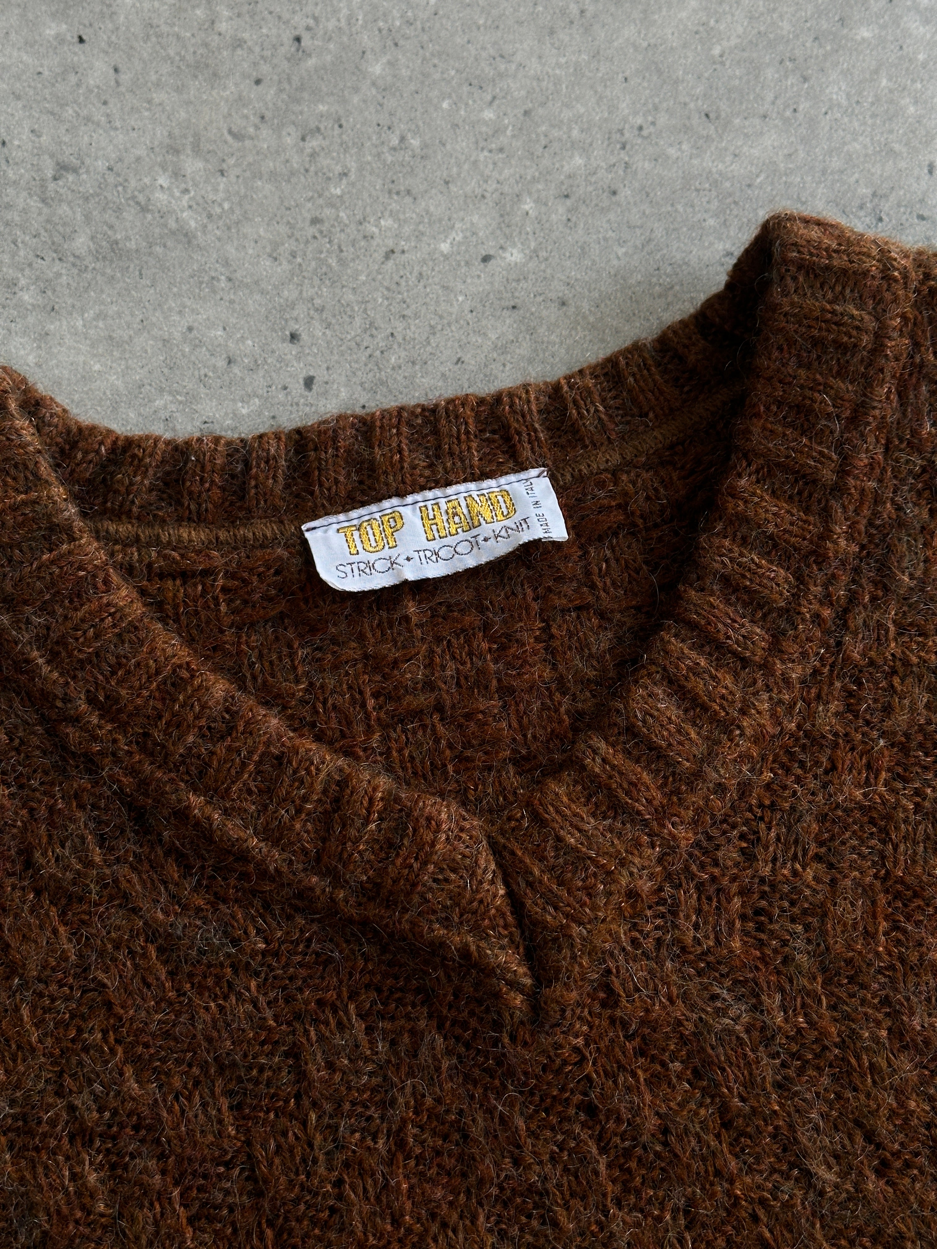 Vintage Italian wool V-neck knitted jumper in size M, showcasing a cozy, textured knit pattern and classic design.