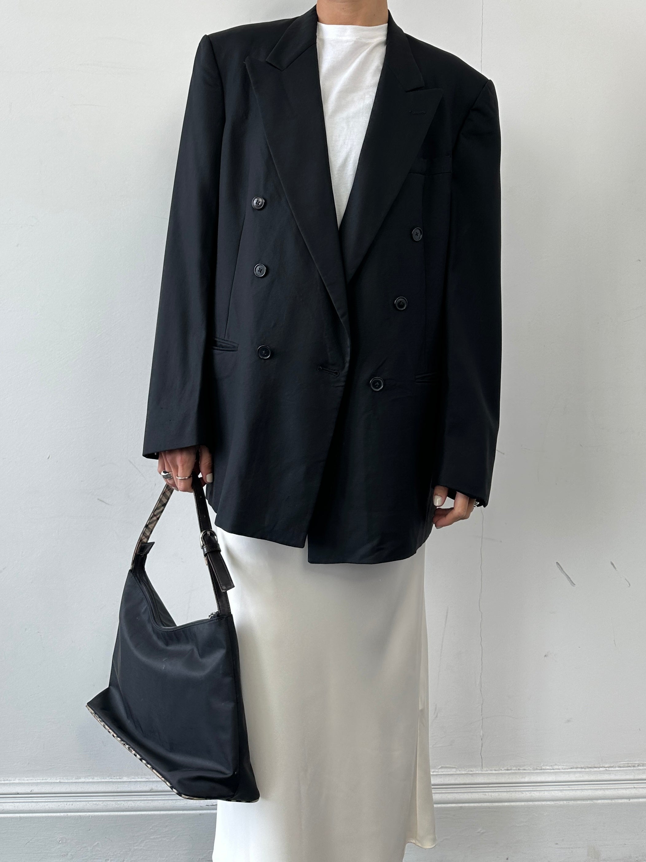 Christian Dior pure wool double-breasted blazer in size L/XL, tailored fit with notch lapels and classic button details.