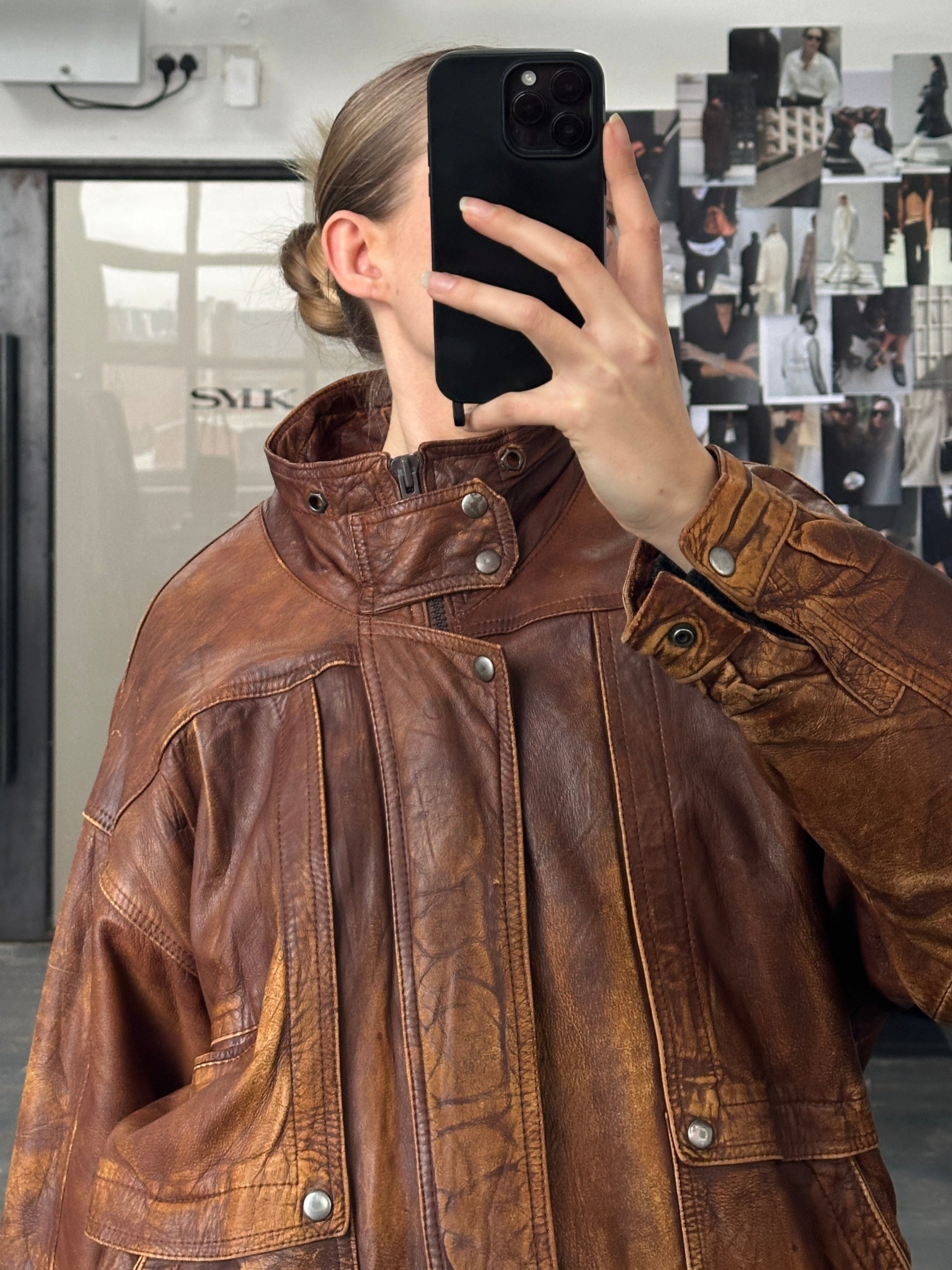 Vintage 1990s Aged Leather Bomber Jacket in XL with distressed finish and classic design, showcasing rugged leather details.