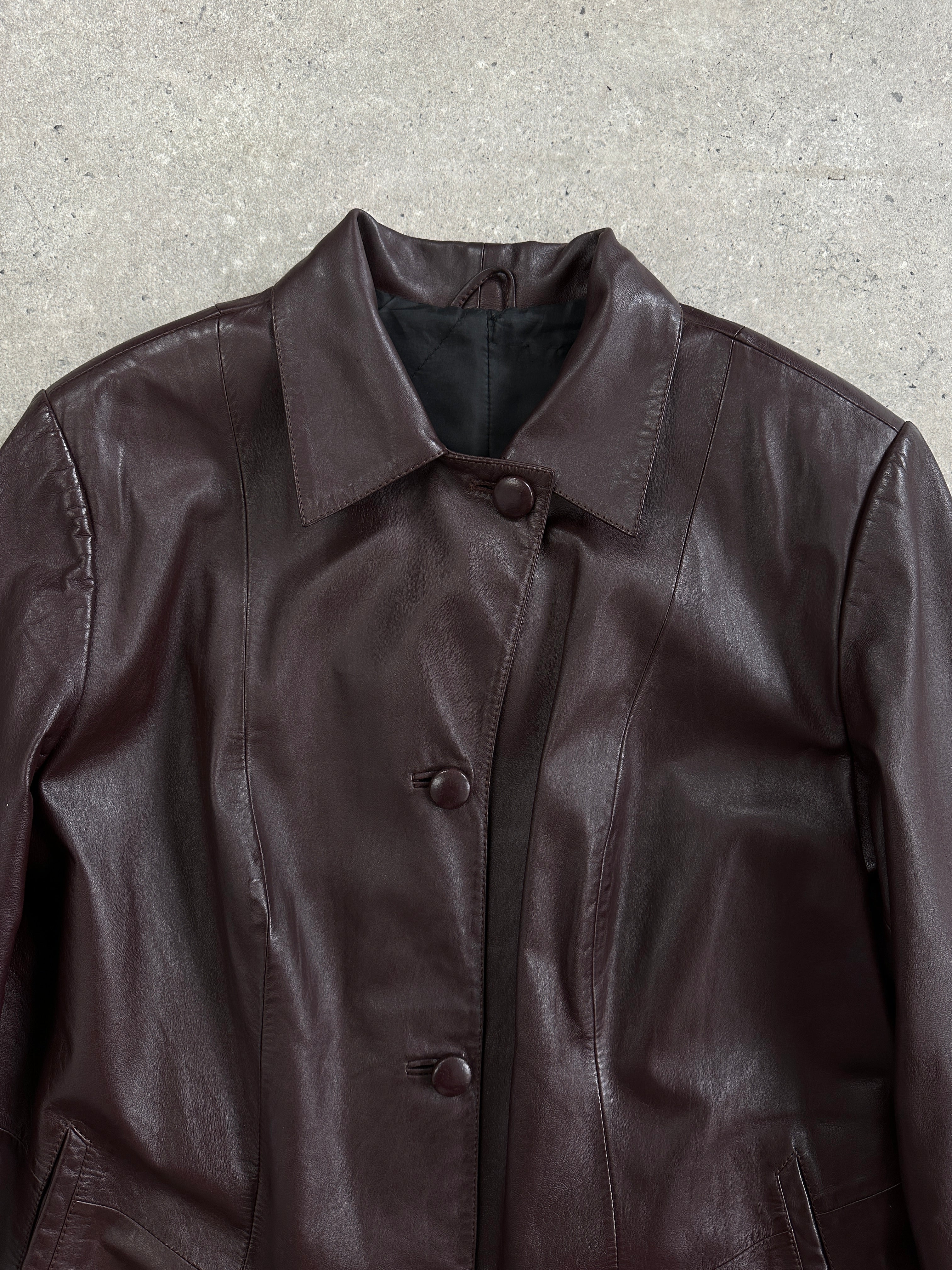 Vintage leather trench coat jacket in size large, featuring classic design and aged leather texture.