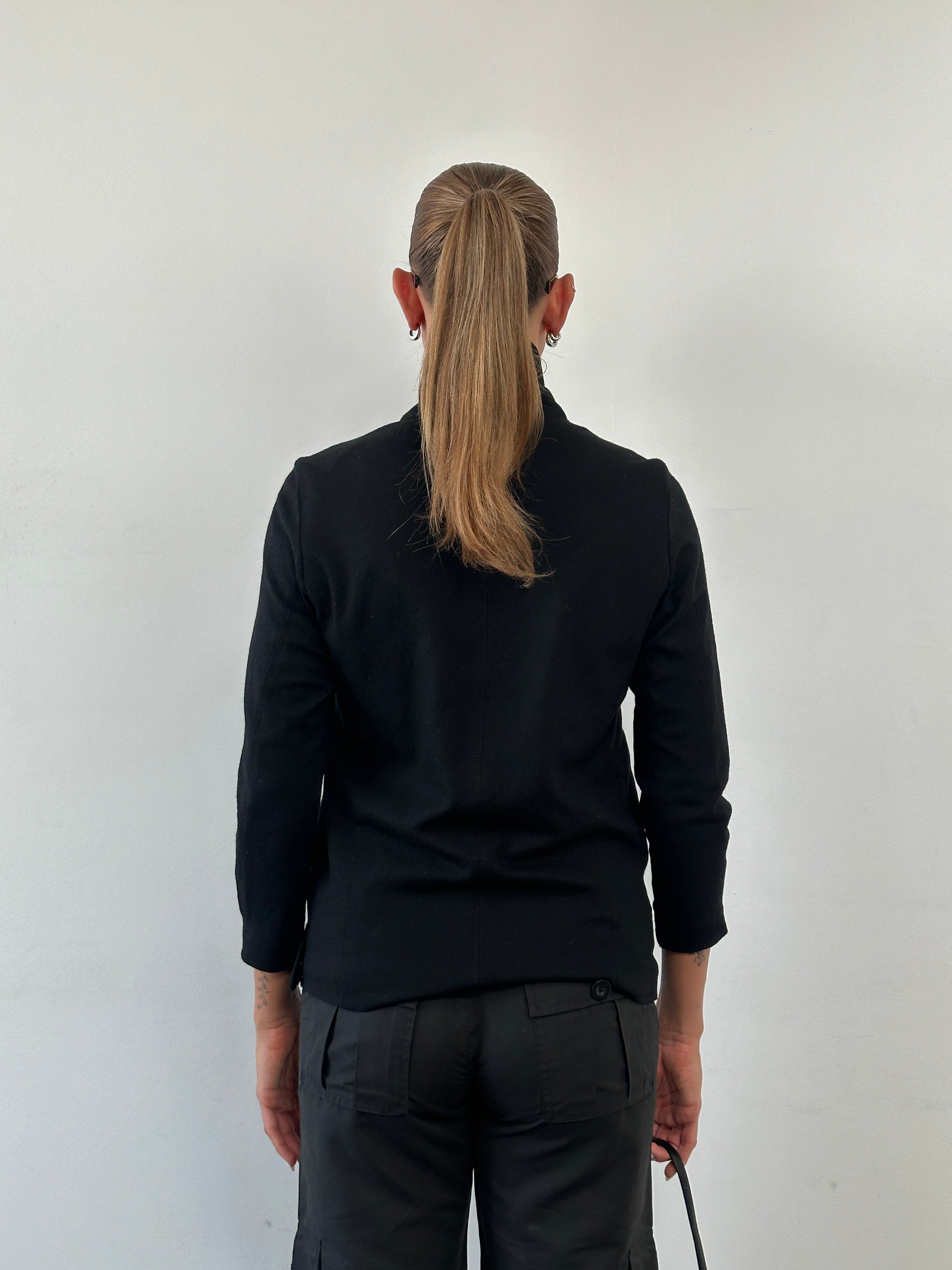 Helmut Lang asymmetric high-neck wool belted jacket in black, front view showing tailored fit and high collar.