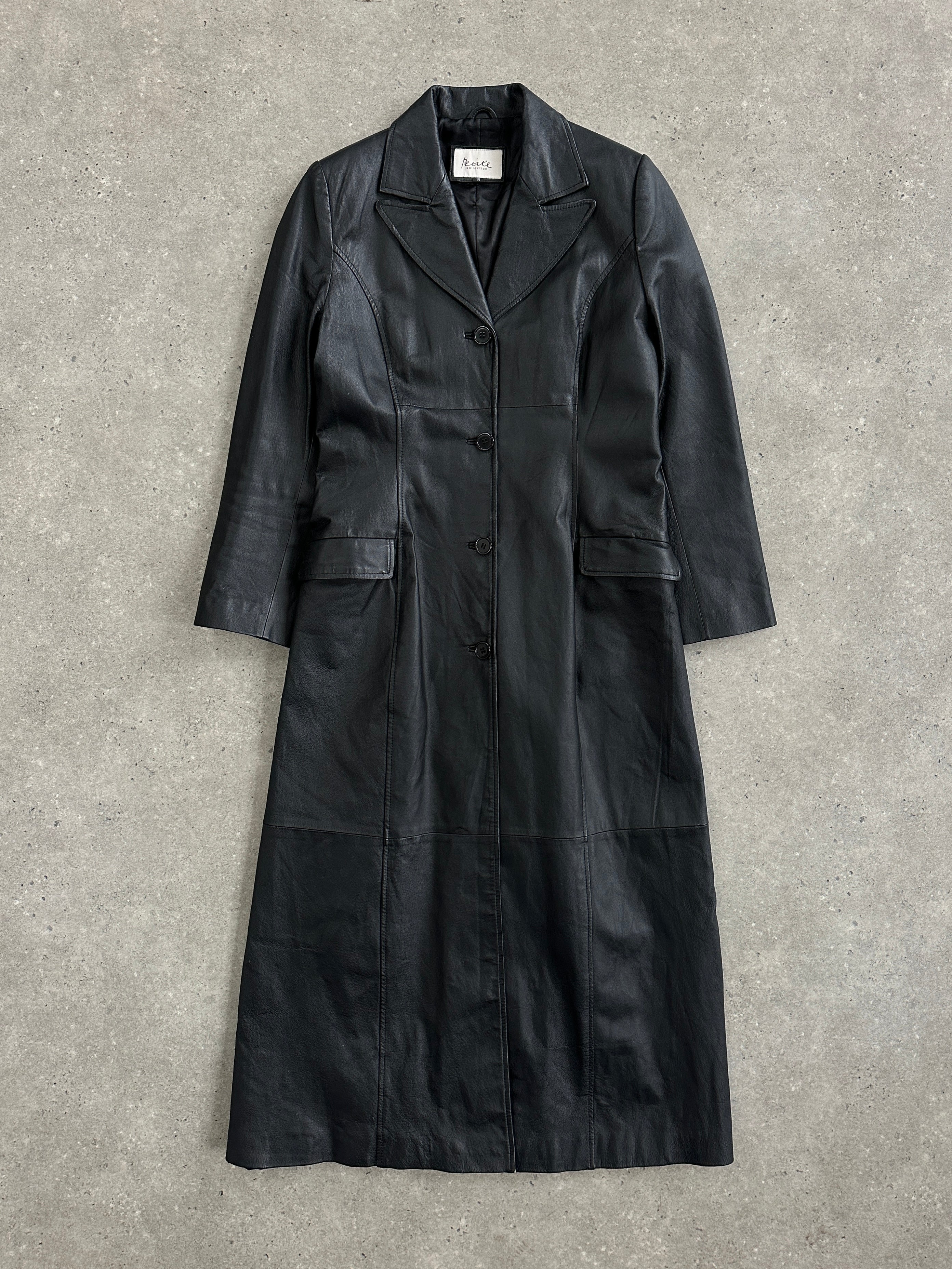 Vintage 1990s floor-length leather trench coat in black, featuring classic design and belt, size S/M, from the Vintage brand.