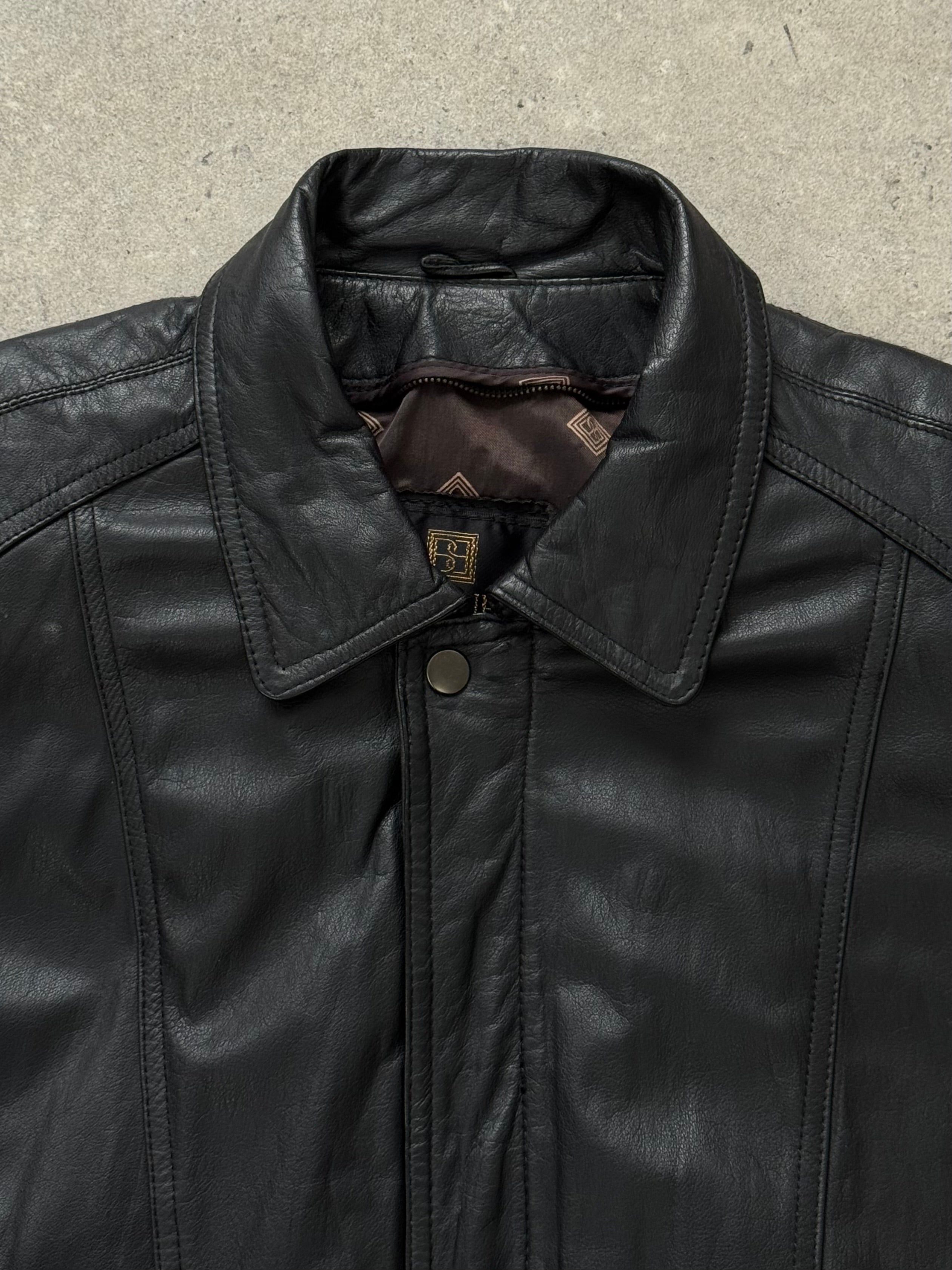 Vintage 1990s leather bomber jacket in size M, featuring classic design, brown leather, and quilted lining.
