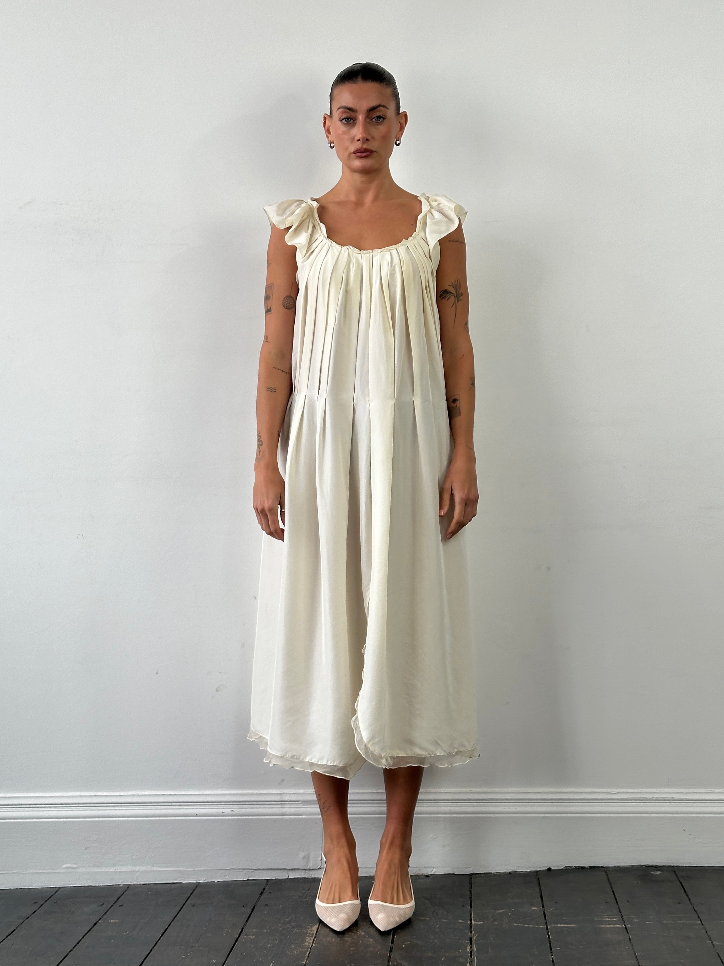 Prada 2012 pure silk pleated slip dress in size large, featuring a sleek, elegant design with delicate pleats and a smooth fabric finish.