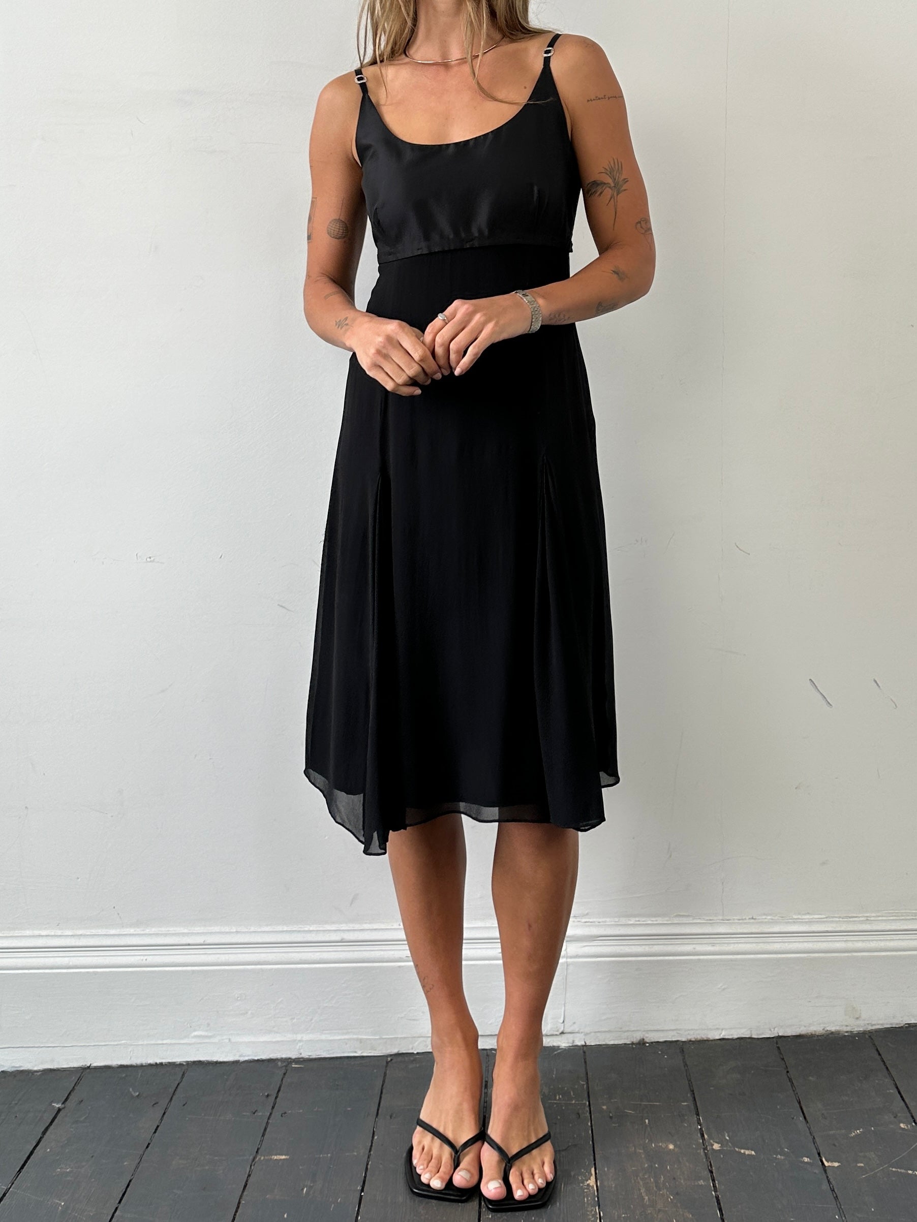Max Mara pure silk pleated midi dress in soft fabric, featuring elegant design and flowing silhouette for sophisticated style.