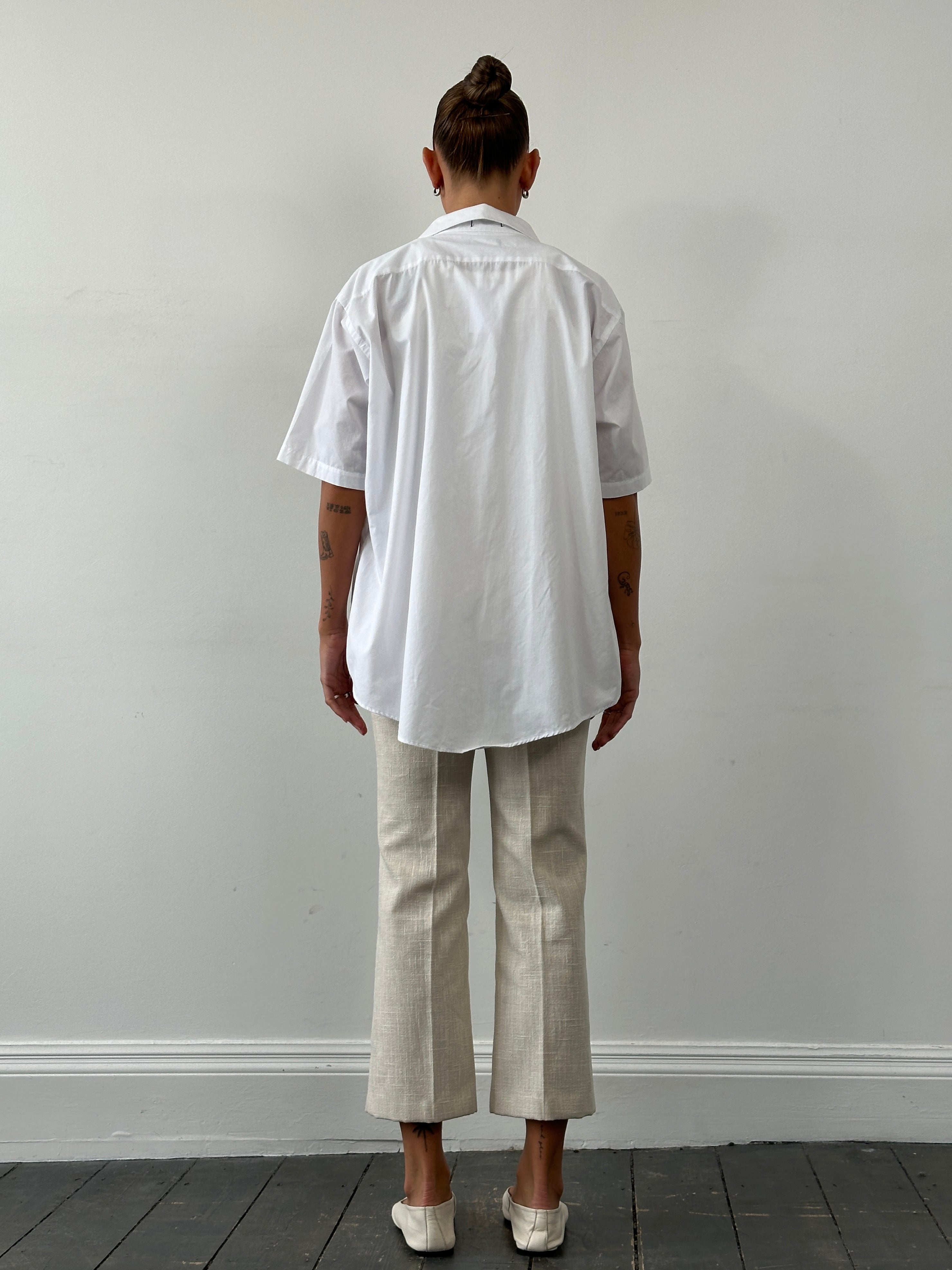 Christian Dior Monsieur short sleeve cotton shirt in XXL, featuring a classic design and light fabric, shown on a hanger.