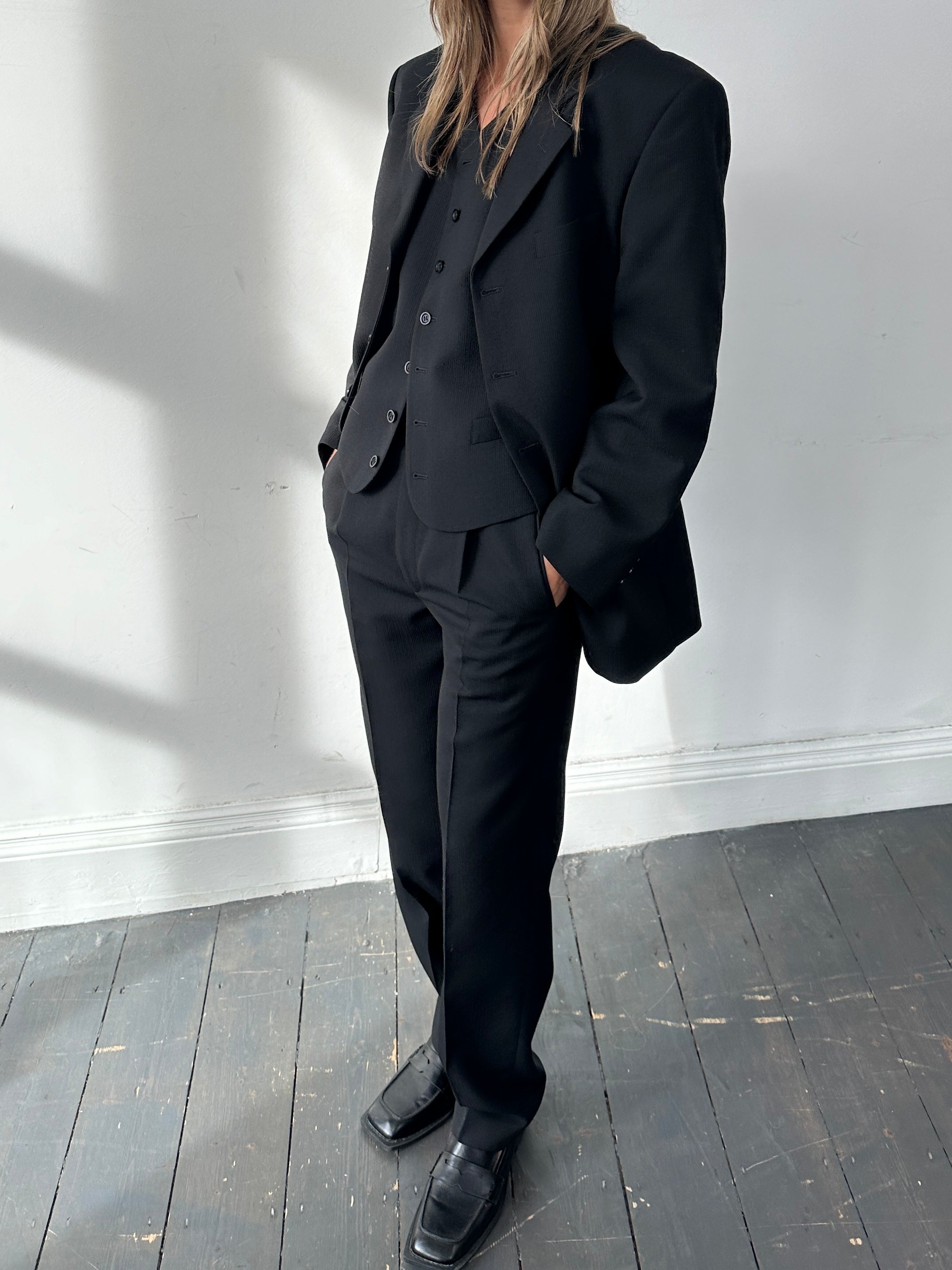 Vintage wool ribbed three-piece suit in size 38R, featuring a tailored jacket, vest, and trousers with classic style.