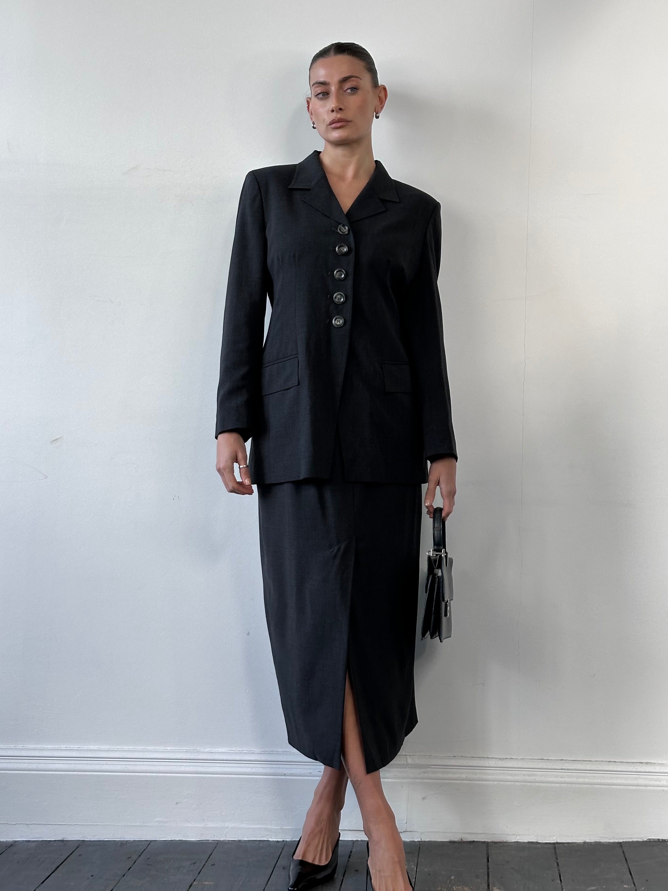 Jaeger 1990s pure wool two-piece skirt suit with fitted blazer and matching pencil skirt, in classic 1990s style.