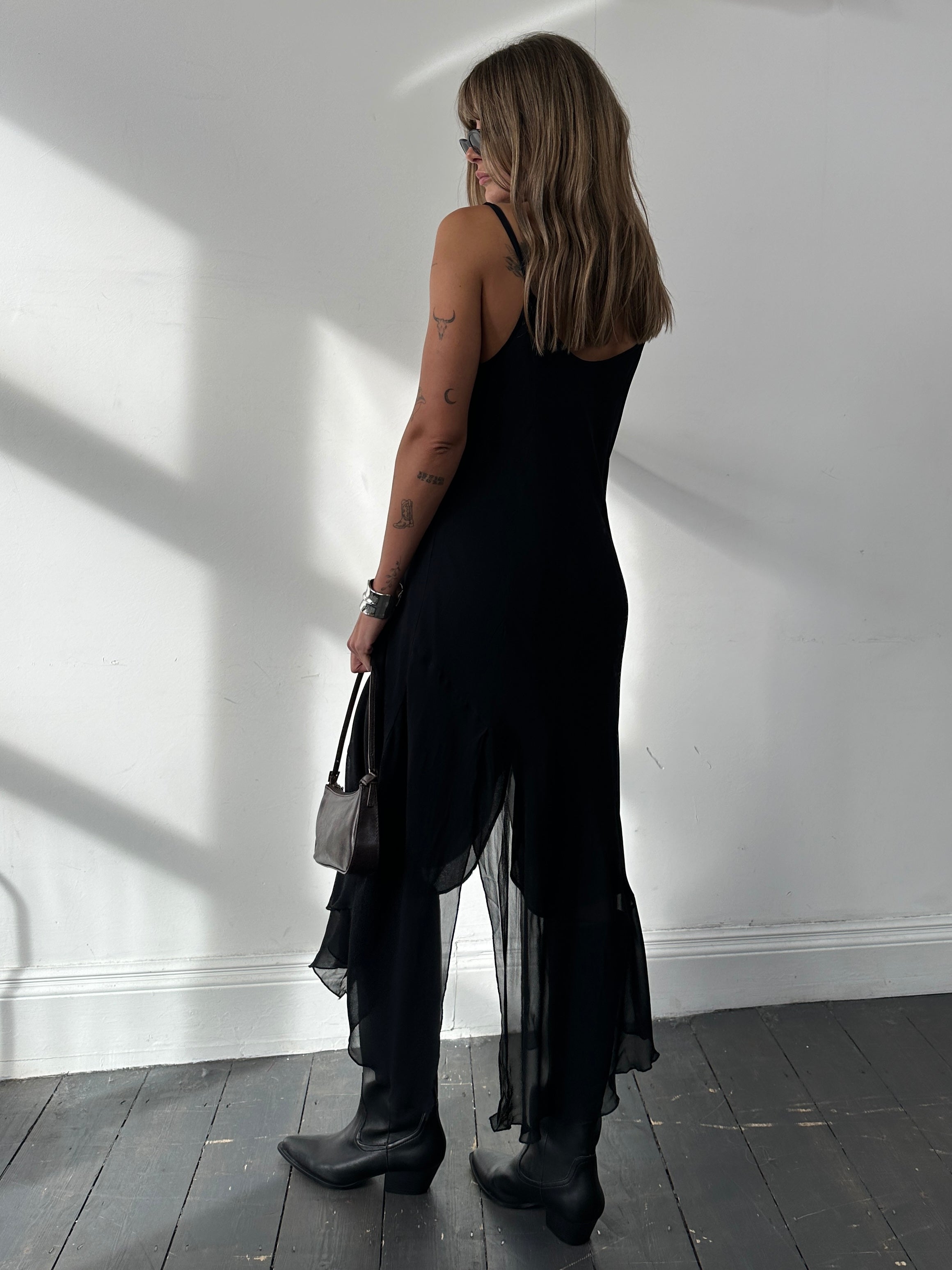 Italian vintage split hem slip dress in size large, featuring flowing fabric and elegant design with a stylish split hem detail.