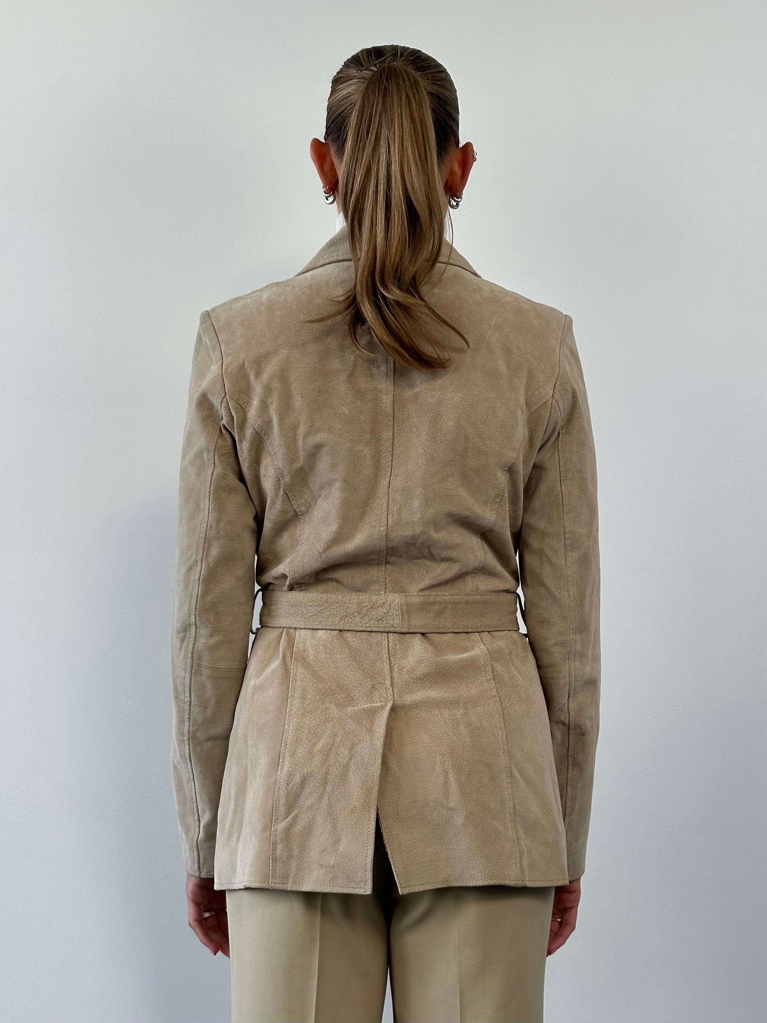 Vintage belted suede jacket in size M, featuring classic design and rich texture, shown on a hanger.