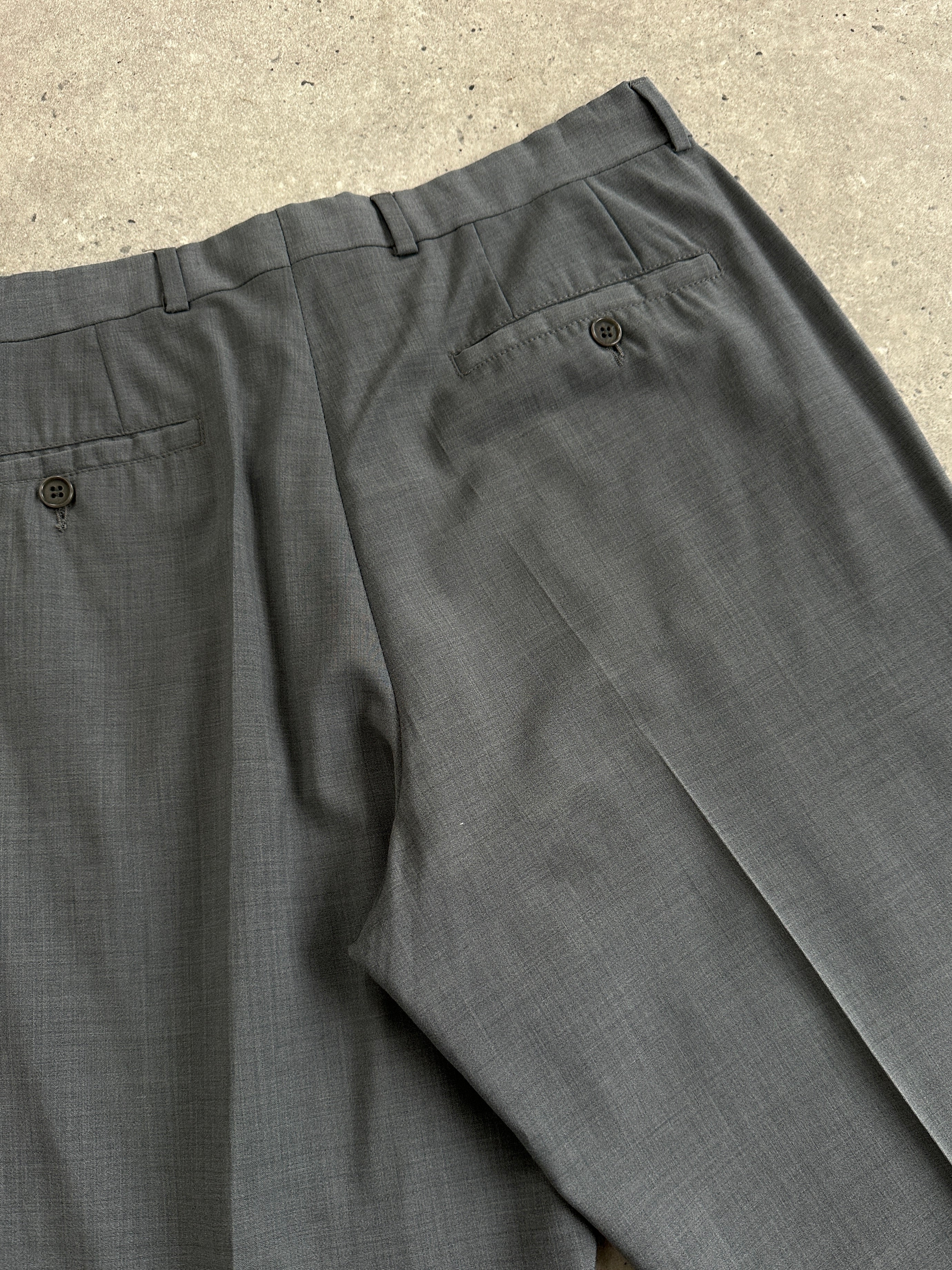 Emporio Armani high waisted tailored wool trousers in navy with a classic fit and belt loops, perfect for professional wear.