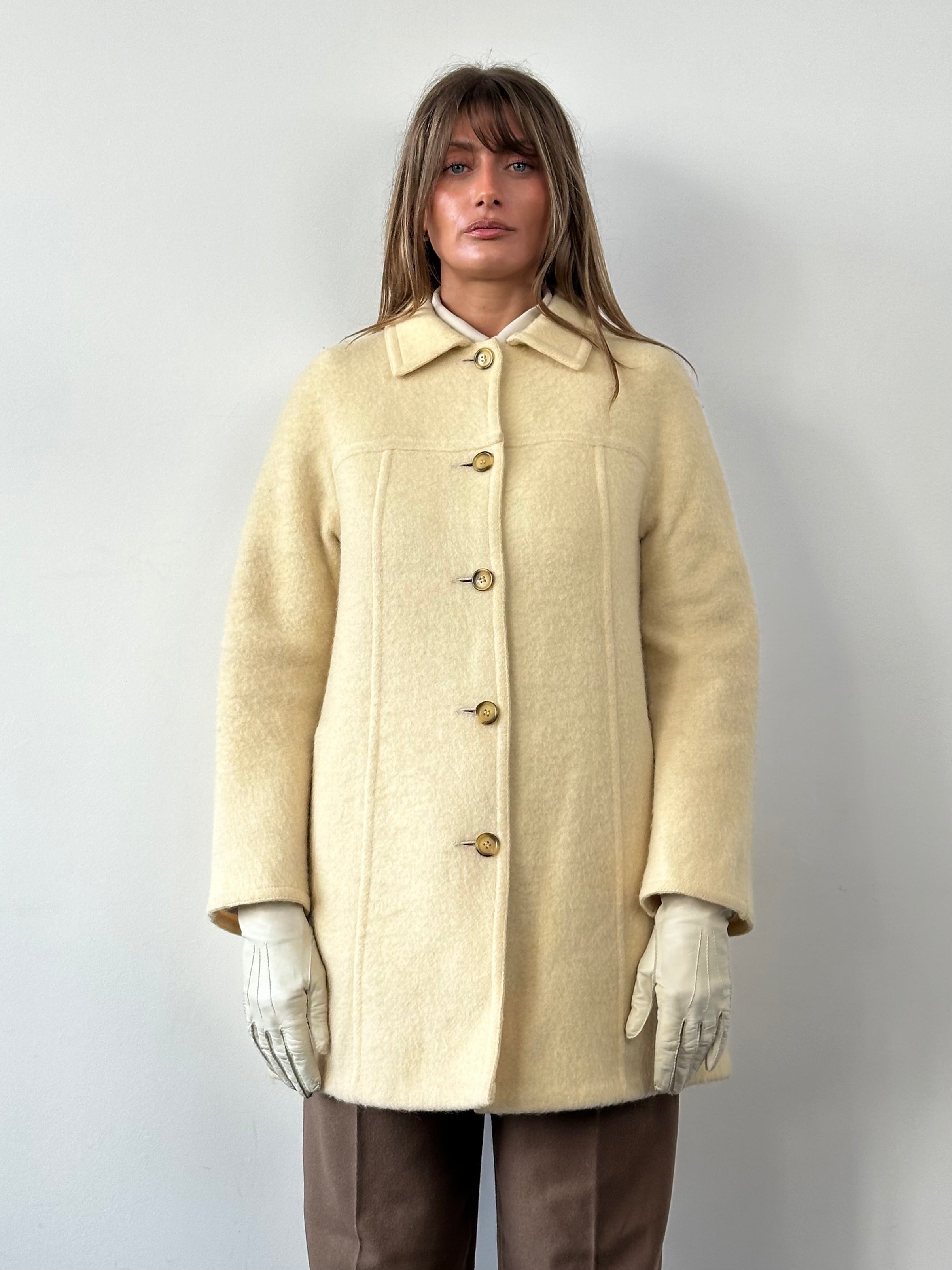 Marella 80s wool double-faced single-breasted coat in neutral tones, shown hanging on a wooden hanger.